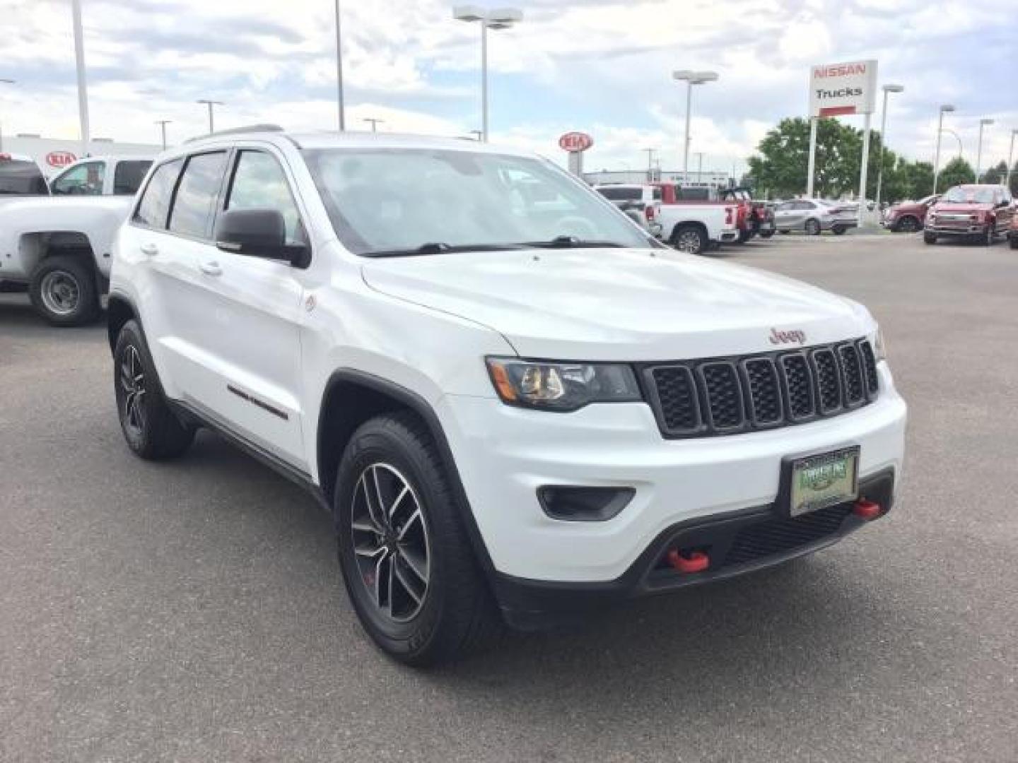 2020 Bright White Clear Coat /Black/Ruby Red, leather Jeep Grand Cherokee Trailhawk 4WD (1C4RJFLG5LC) with an 3.6L V6 DOHC 24V engine, 8-Speed Automatic transmission, located at 1235 N Woodruff Ave., Idaho Falls, 83401, (208) 523-1053, 43.507172, -112.000488 - Leather and loaded, heated and cooled seats, blind spot monitors, AWD, low miles. At Timberline Auto it is always easy to find a great deal on your next vehicle! Our experienced sales staff can help find the right vehicle that will fit your needs. Our knowledgeable finance department has options for - Photo#6