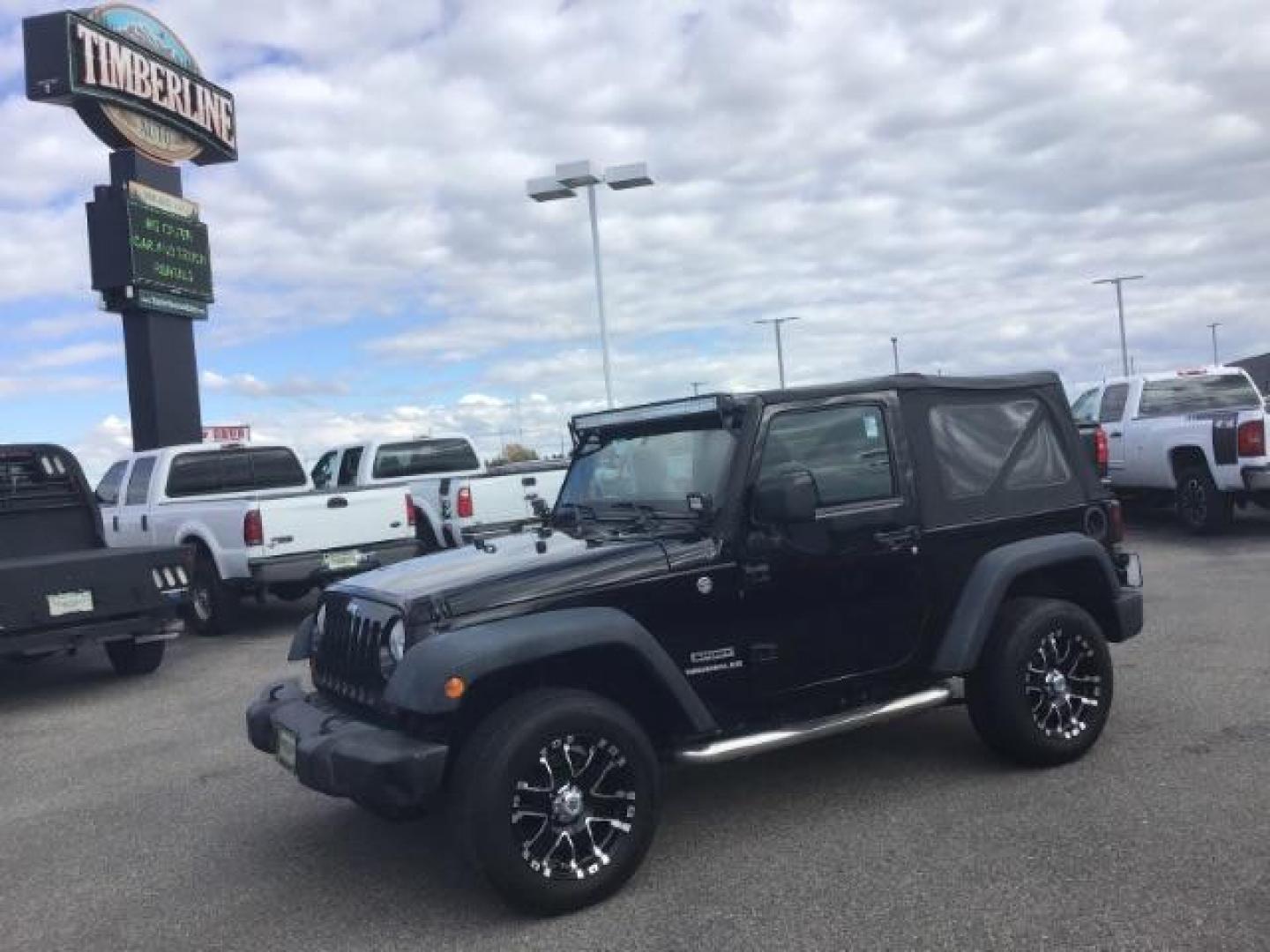 2011 Black with Black Soft Top /Black Cloth Interior Jeep Wrangler Sport 4WD (1J4AA2D12BL) with an 3.8L V6 OHV 12V engine, 6-Speed Manual transmission, located at 1235 N Woodruff Ave., Idaho Falls, 83401, (208) 523-1053, 43.507172, -112.000488 - This 2011 Jeep Wrangler Sport, has the 3.8 V6 motor. It has 100,948 miles. Comes with air conditioning, cd player, running boards, alloy wheels, and has a soft top. At Timberline Auto it is always easy to find a great deal on your next vehicle! Our experienced sales staff can help find the right veh - Photo#0