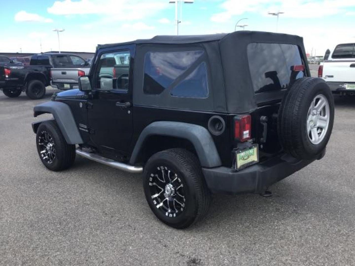 2011 Black with Black Soft Top /Black Cloth Interior Jeep Wrangler Sport 4WD (1J4AA2D12BL) with an 3.8L V6 OHV 12V engine, 6-Speed Manual transmission, located at 1235 N Woodruff Ave., Idaho Falls, 83401, (208) 523-1053, 43.507172, -112.000488 - This 2011 Jeep Wrangler Sport, has the 3.8 V6 motor. It has 100,948 miles. Comes with air conditioning, cd player, running boards, alloy wheels, and has a soft top. At Timberline Auto it is always easy to find a great deal on your next vehicle! Our experienced sales staff can help find the right veh - Photo#2