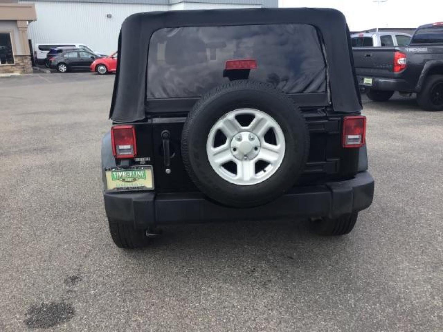 2011 Black with Black Soft Top /Black Cloth Interior Jeep Wrangler Sport 4WD (1J4AA2D12BL) with an 3.8L V6 OHV 12V engine, 6-Speed Manual transmission, located at 1235 N Woodruff Ave., Idaho Falls, 83401, (208) 523-1053, 43.507172, -112.000488 - This 2011 Jeep Wrangler Sport, has the 3.8 V6 motor. It has 100,948 miles. Comes with air conditioning, cd player, running boards, alloy wheels, and has a soft top. At Timberline Auto it is always easy to find a great deal on your next vehicle! Our experienced sales staff can help find the right veh - Photo#3