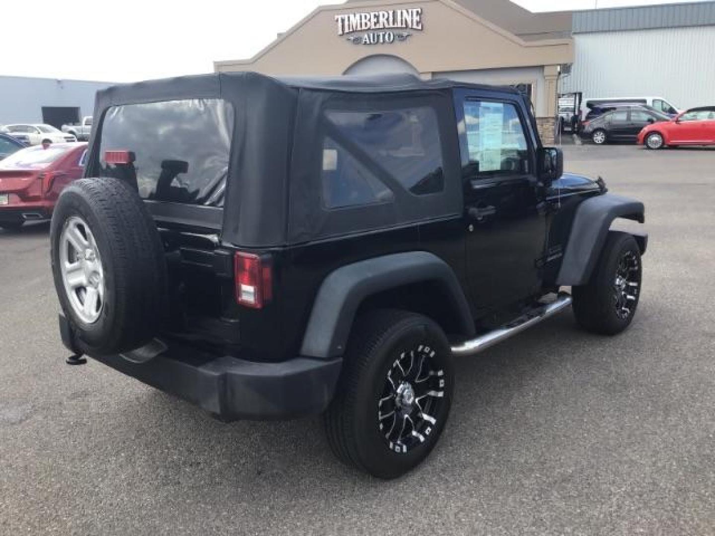 2011 Black with Black Soft Top /Black Cloth Interior Jeep Wrangler Sport 4WD (1J4AA2D12BL) with an 3.8L V6 OHV 12V engine, 6-Speed Manual transmission, located at 1235 N Woodruff Ave., Idaho Falls, 83401, (208) 523-1053, 43.507172, -112.000488 - This 2011 Jeep Wrangler Sport, has the 3.8 V6 motor. It has 100,948 miles. Comes with air conditioning, cd player, running boards, alloy wheels, and has a soft top. At Timberline Auto it is always easy to find a great deal on your next vehicle! Our experienced sales staff can help find the right veh - Photo#4