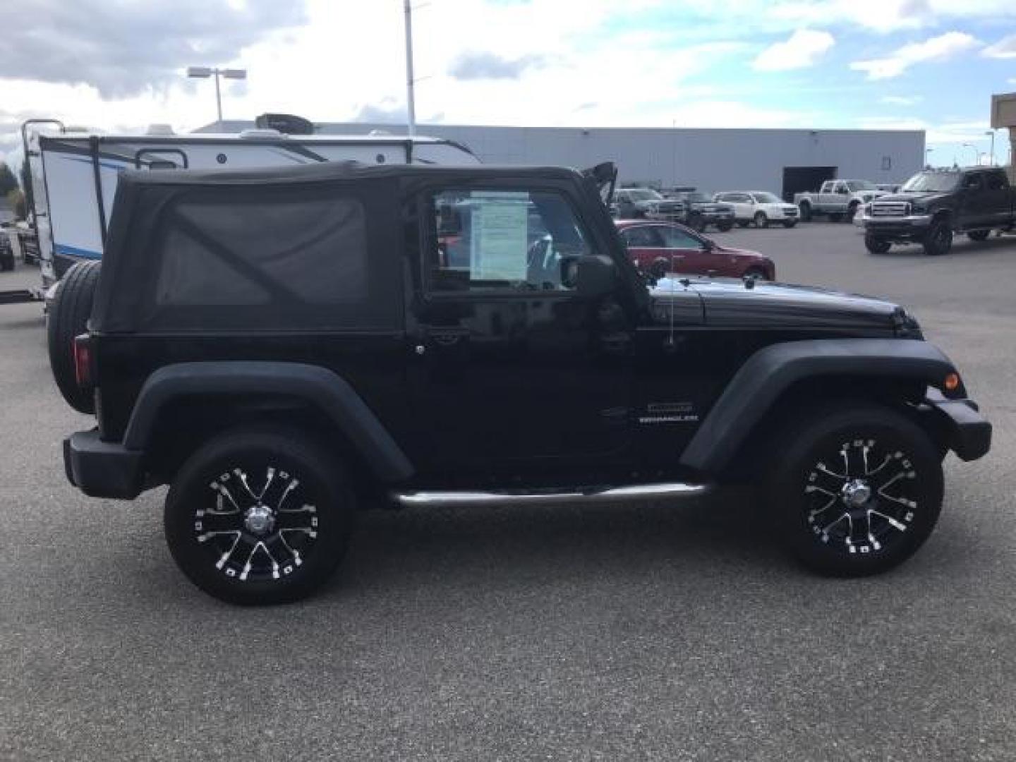 2011 Black with Black Soft Top /Black Cloth Interior Jeep Wrangler Sport 4WD (1J4AA2D12BL) with an 3.8L V6 OHV 12V engine, 6-Speed Manual transmission, located at 1235 N Woodruff Ave., Idaho Falls, 83401, (208) 523-1053, 43.507172, -112.000488 - This 2011 Jeep Wrangler Sport, has the 3.8 V6 motor. It has 100,948 miles. Comes with air conditioning, cd player, running boards, alloy wheels, and has a soft top. At Timberline Auto it is always easy to find a great deal on your next vehicle! Our experienced sales staff can help find the right veh - Photo#5