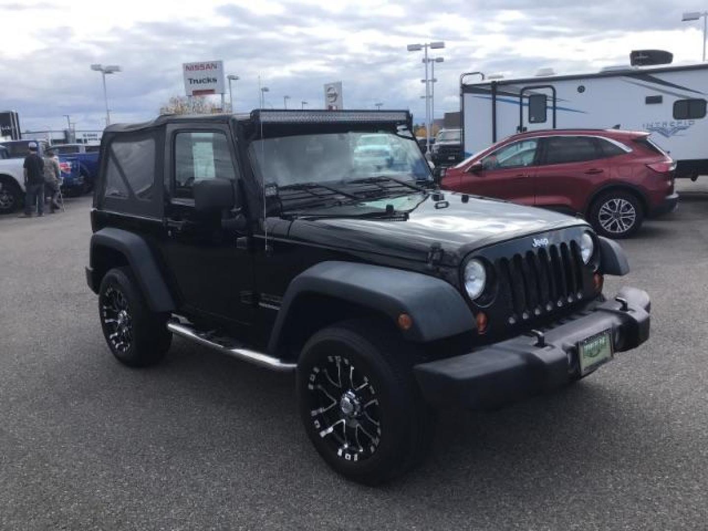 2011 Black with Black Soft Top /Black Cloth Interior Jeep Wrangler Sport 4WD (1J4AA2D12BL) with an 3.8L V6 OHV 12V engine, 6-Speed Manual transmission, located at 1235 N Woodruff Ave., Idaho Falls, 83401, (208) 523-1053, 43.507172, -112.000488 - This 2011 Jeep Wrangler Sport, has the 3.8 V6 motor. It has 100,948 miles. Comes with air conditioning, cd player, running boards, alloy wheels, and has a soft top. At Timberline Auto it is always easy to find a great deal on your next vehicle! Our experienced sales staff can help find the right veh - Photo#6