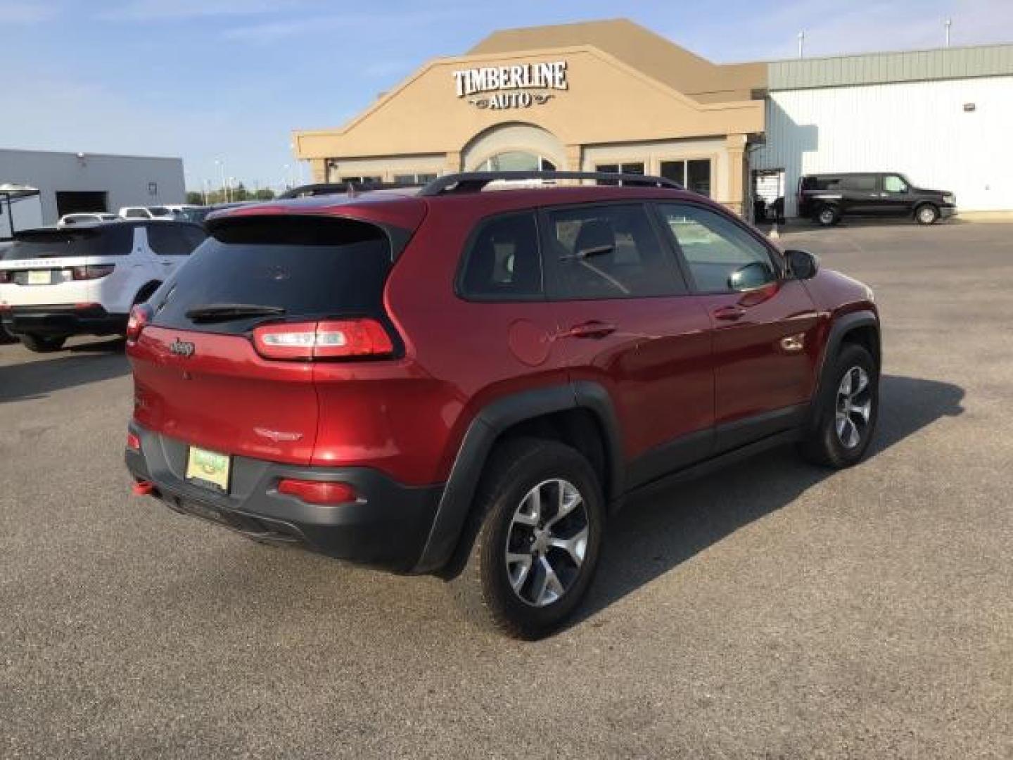 2017 Deep Cherry Red Crystal Pearl Coat /Black, leather/cloth Jeep Cherokee Trailhawk 4WD (1C4PJMBB0HW) with an 2.4L L4 DOHC 16V engine, 9-Speed Automatic transmission, located at 1235 N Woodruff Ave., Idaho Falls, 83401, (208) 523-1053, 43.507172, -112.000488 - This 2017 Jeep Cherokee Trail Hawk, Has the 2.4L motor. It has 137,365 miles. It has leather interior, heated seats, keyless remote, tinted glass. Interior and Exterior, are in excellent condition. At Timberline Auto it is always easy to find a great deal on your next vehicle! Our experienced sales - Photo#4