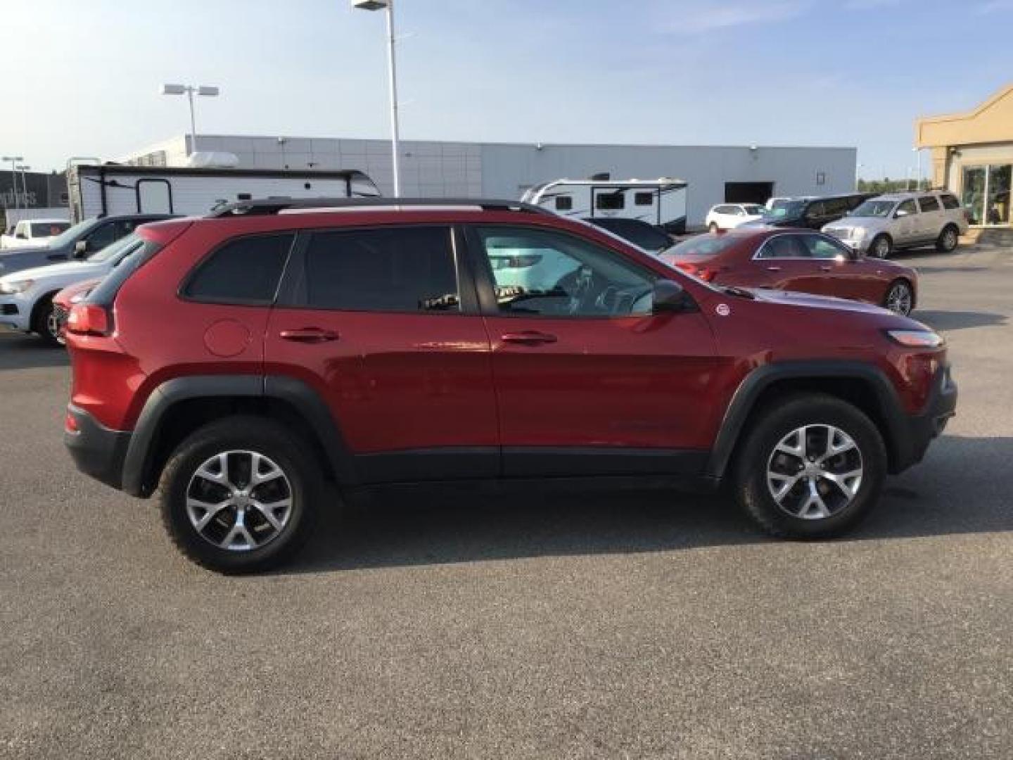 2017 Deep Cherry Red Crystal Pearl Coat /Black, leather/cloth Jeep Cherokee Trailhawk 4WD (1C4PJMBB0HW) with an 2.4L L4 DOHC 16V engine, 9-Speed Automatic transmission, located at 1235 N Woodruff Ave., Idaho Falls, 83401, (208) 523-1053, 43.507172, -112.000488 - This 2017 Jeep Cherokee Trail Hawk, Has the 2.4L motor. It has 137,365 miles. It has leather interior, heated seats, keyless remote, tinted glass. Interior and Exterior, are in excellent condition. At Timberline Auto it is always easy to find a great deal on your next vehicle! Our experienced sales - Photo#5