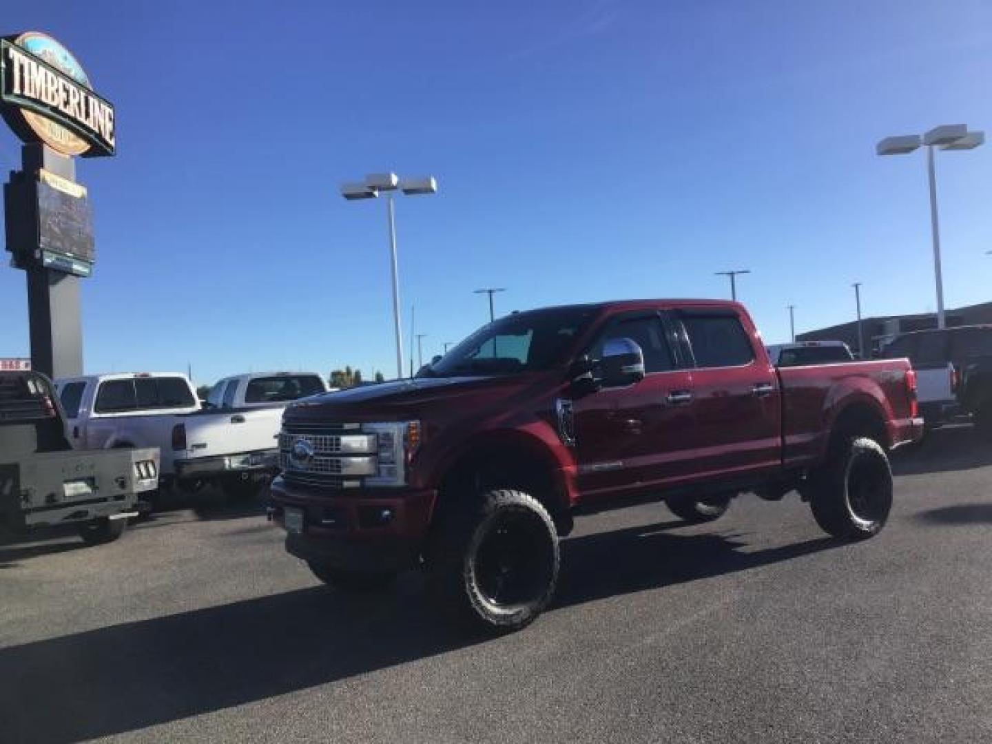 2018 RED /LEATHER Ford F-350 SD PLATINUM (1FT8W3BT4JE) with an 6.7 engine, AUTOMATIC transmission, located at 1235 N Woodruff Ave., Idaho Falls, 83401, (208) 523-1053, 43.507172, -112.000488 - This 2018 Ford F350 Platinum , has the 6.7L V8 diesel motor. Comes with retractable running boards, turnover ball, in the bed of the truck, push button start, navigation, lift kit, heated and cooled seats, sunroof, and bluetooth. At Timberline Auto it is always easy to find a great deal on your next - Photo#0