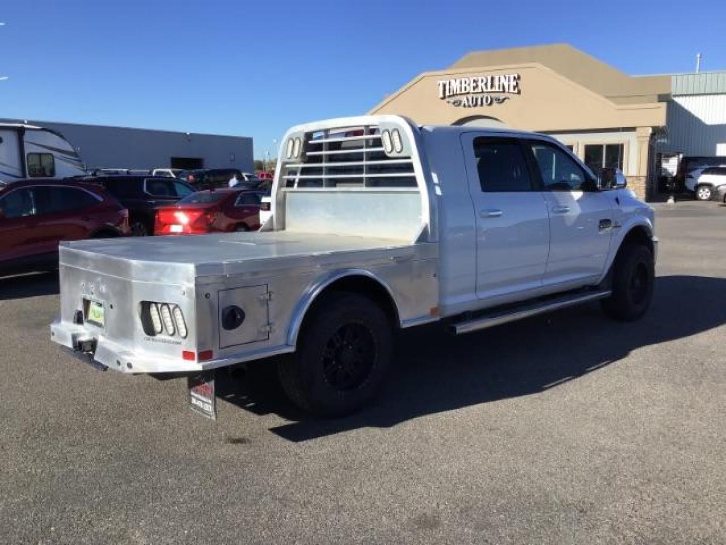 2015 Bright White Clear Coat /LEATHER RAM 2500 Longhorn Mega Cab SWB 4WD (3C6UR5PL9FG) with an 6.7L L6 OHV 24V TURBO DIESEL engine, 6-Speed Automatic transmission, located at 1235 N Woodruff Ave., Idaho Falls, 83401, (208) 523-1053, 43.507172, -112.000488 - This 2015 Ram 2500 Mega Cab Longhorn Edition, has the 6.7L Diesel motor. It has 159,423 miles. It comes with a flat bed, running boards, sunroof, heated and cooled seats, and rear heated seats. At Timberline Auto it is always easy to find a great deal on your next vehicle! Our experienced sales st - Photo#4