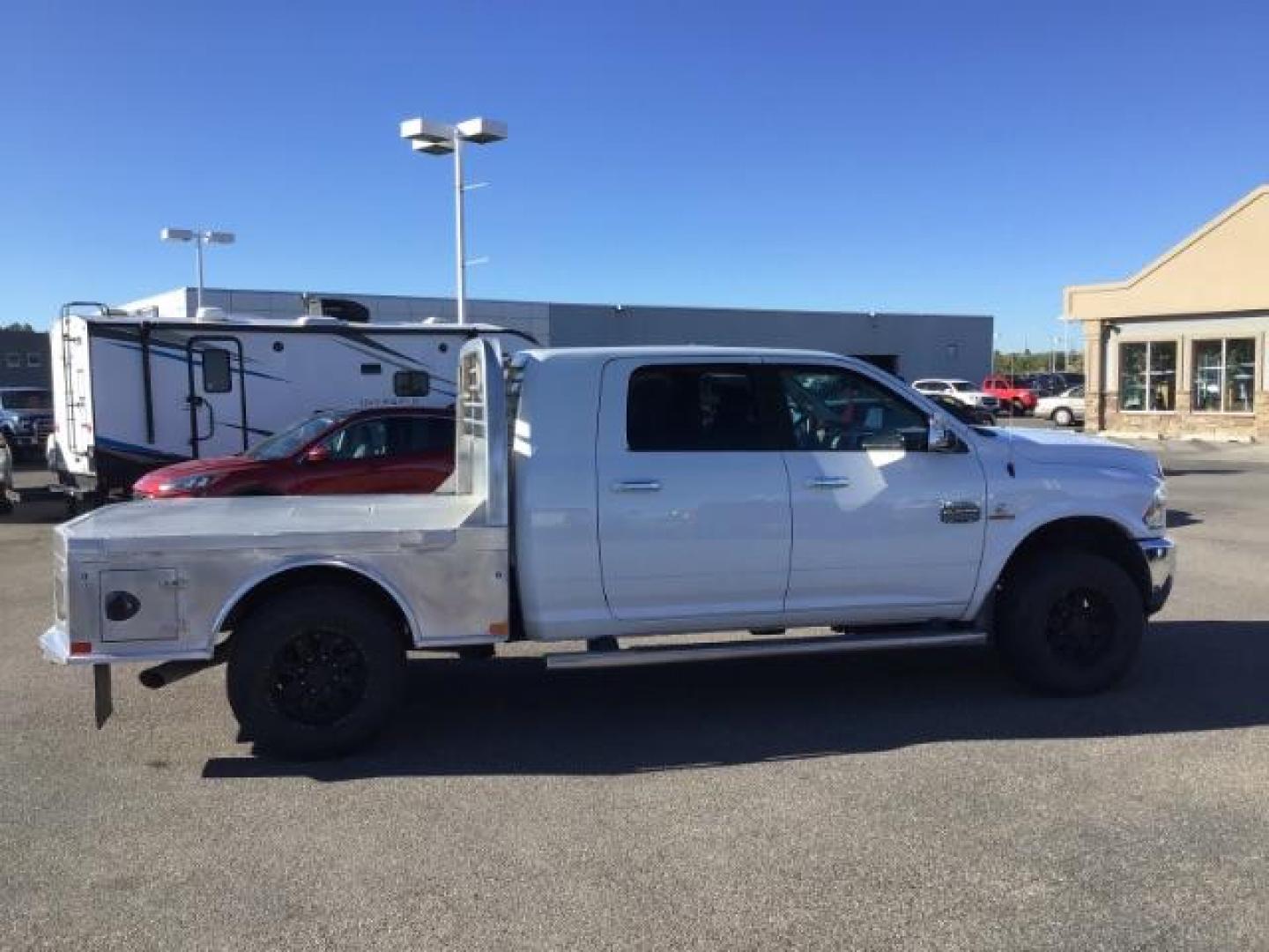 2015 Bright White Clear Coat /LEATHER RAM 2500 Longhorn Mega Cab SWB 4WD (3C6UR5PL9FG) with an 6.7L L6 OHV 24V TURBO DIESEL engine, 6-Speed Automatic transmission, located at 1235 N Woodruff Ave., Idaho Falls, 83401, (208) 523-1053, 43.507172, -112.000488 - This 2015 Ram 2500 Mega Cab Longhorn Edition, has the 6.7L Diesel motor. It has 159,423 miles. It comes with a flat bed, running boards, sunroof, heated and cooled seats, and rear heated seats. At Timberline Auto it is always easy to find a great deal on your next vehicle! Our experienced sales st - Photo#5