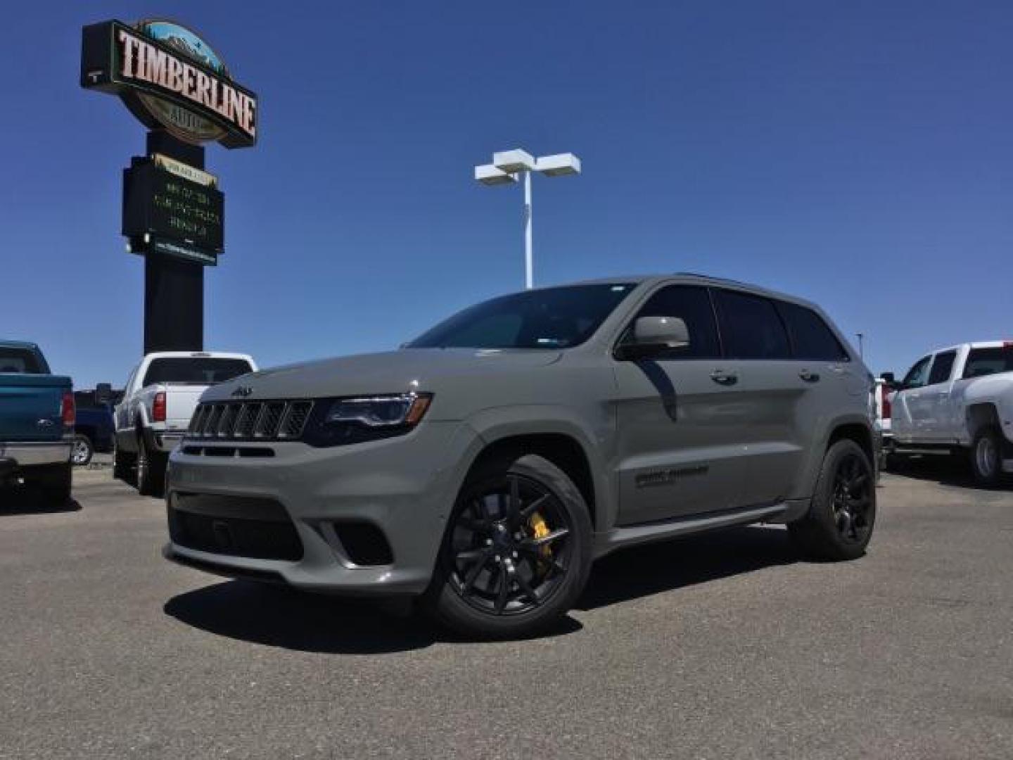 2021 Sting-Gray Clear Coat /Black, premium leather/sueded microfiber Jeep Grand Cherokee Trackhawk (1C4RJFN92MC) with an 6.2L V8 SUPERCHARGED engine, 8-Speed Automatic transmission, located at 1235 N Woodruff Ave., Idaho Falls, 83401, (208) 523-1053, 43.507172, -112.000488 - Here's a 2021 Jeep Grand Cherokee TrackHawk! This is a 6.2L Supercharged V8 SUV! It seats 5 people, has a massive cargo area, and it's AWD, so you'll be able to enjoy it year round! This Jeep has 707 horsepower and a 0-60 in just 3.5 seconds! The TrackHawk focused on power but that doesn't mean it s - Photo#0