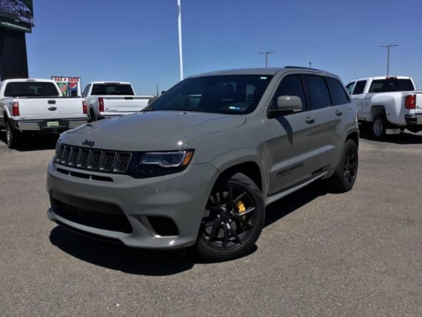 2021 Sting-Gray Clear Coat /Black, premium leather/sueded microfiber Jeep Grand Cherokee Trackhawk (1C4RJFN92MC) with an 6.2L V8 SUPERCHARGED engine, 8-Speed Automatic transmission, located at 1235 N Woodruff Ave., Idaho Falls, 83401, (208) 523-1053, 43.507172, -112.000488 - Here's a 2021 Jeep Grand Cherokee TrackHawk! This is a 6.2L Supercharged V8 SUV! It seats 5 people, has a massive cargo area, and it's AWD, so you'll be able to enjoy it year round! This Jeep has 707 horsepower and a 0-60 in just 3.5 seconds! The TrackHawk focused on power but that doesn't mean it s - Photo#1