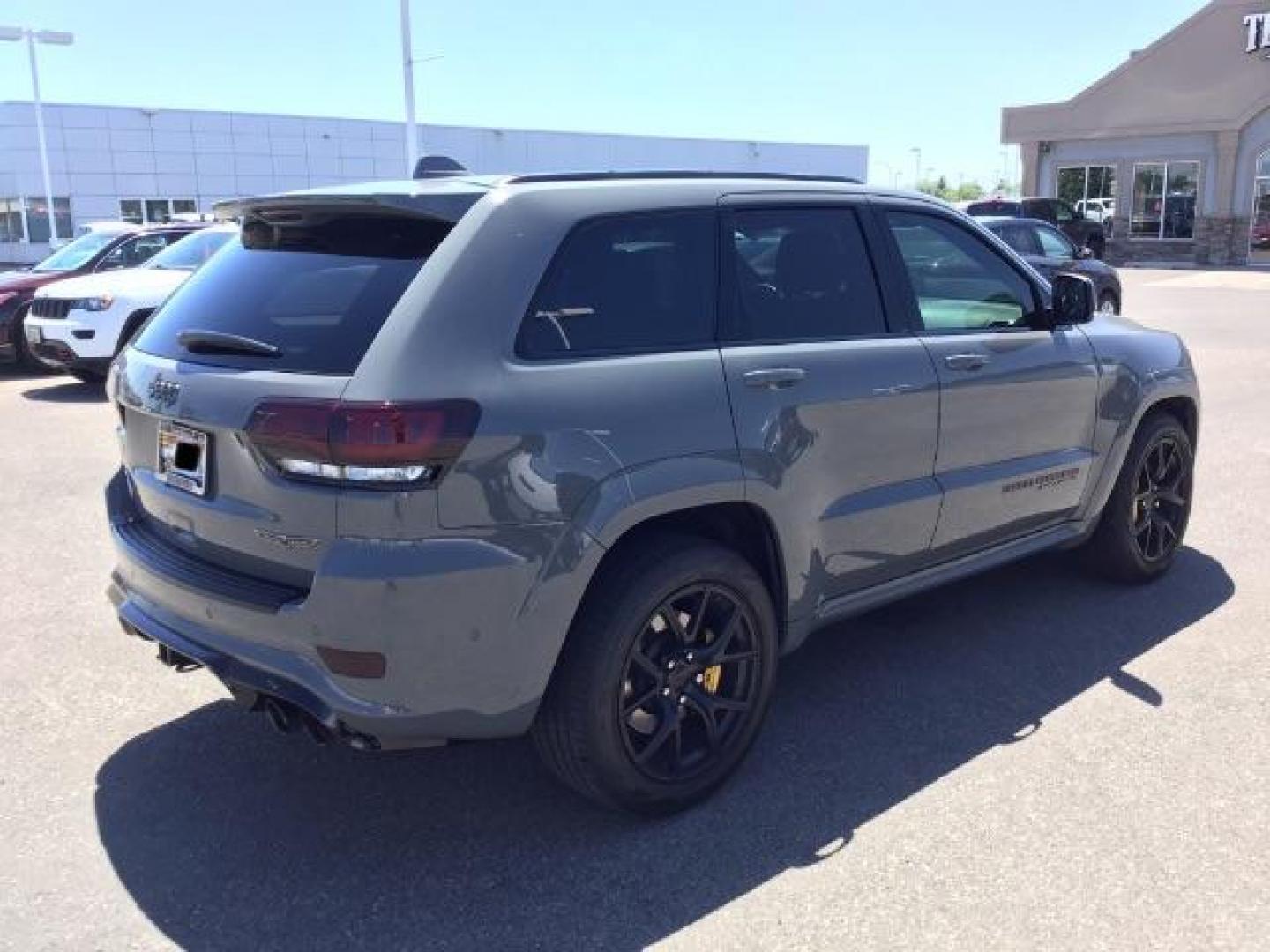 2021 Sting-Gray Clear Coat /Black, premium leather/sueded microfiber Jeep Grand Cherokee Trackhawk (1C4RJFN92MC) with an 6.2L V8 SUPERCHARGED engine, 8-Speed Automatic transmission, located at 1235 N Woodruff Ave., Idaho Falls, 83401, (208) 523-1053, 43.507172, -112.000488 - Here's a 2021 Jeep Grand Cherokee TrackHawk! This is a 6.2L Supercharged V8 SUV! It seats 5 people, has a massive cargo area, and it's AWD, so you'll be able to enjoy it year round! This Jeep has 707 horsepower and a 0-60 in just 3.5 seconds! The TrackHawk focused on power but that doesn't mean it s - Photo#6