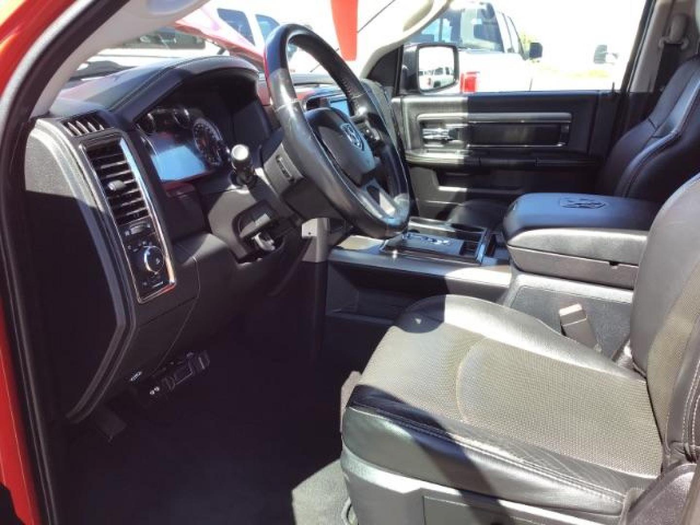 2013 Flame Red /Black Cloth Interior RAM 1500 Sport Quad Cab 4WD (1C6RR7HT4DS) with an 5.7L V8 OHV 16V engine, 6-Speed Automatic transmission, located at 1235 N Woodruff Ave., Idaho Falls, 83401, (208) 523-1053, 43.507172, -112.000488 - Leather, sport package, 4X4, Bluetooth, Alpine Sound System, heated and cooled seats, heated steering wheel, tow package, 6.6' bed, Tonneau cover. At Timberline Auto it is always easy to find a great deal on your next vehicle! Our experienced sales staff can help find the right vehicle that will fi - Photo#13