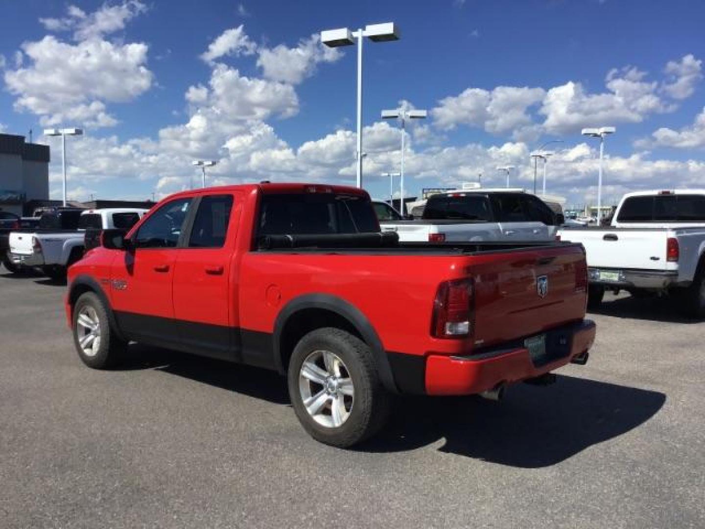 2013 Flame Red /Black Cloth Interior RAM 1500 Sport Quad Cab 4WD (1C6RR7HT4DS) with an 5.7L V8 OHV 16V engine, 6-Speed Automatic transmission, located at 1235 N Woodruff Ave., Idaho Falls, 83401, (208) 523-1053, 43.507172, -112.000488 - Leather, sport package, 4X4, Bluetooth, Alpine Sound System, heated and cooled seats, heated steering wheel, tow package, 6.6' bed, Tonneau cover. At Timberline Auto it is always easy to find a great deal on your next vehicle! Our experienced sales staff can help find the right vehicle that will fi - Photo#2