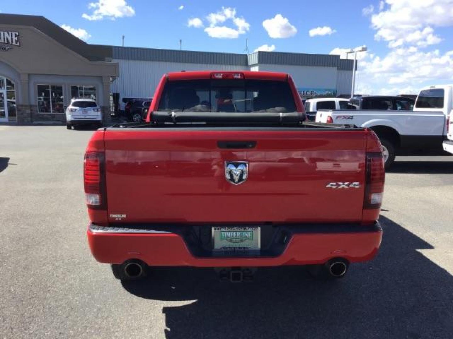 2013 Flame Red /Black Cloth Interior RAM 1500 Sport Quad Cab 4WD (1C6RR7HT4DS) with an 5.7L V8 OHV 16V engine, 6-Speed Automatic transmission, located at 1235 N Woodruff Ave., Idaho Falls, 83401, (208) 523-1053, 43.507172, -112.000488 - Leather, sport package, 4X4, Bluetooth, Alpine Sound System, heated and cooled seats, heated steering wheel, tow package, 6.6' bed, Tonneau cover. At Timberline Auto it is always easy to find a great deal on your next vehicle! Our experienced sales staff can help find the right vehicle that will fi - Photo#3