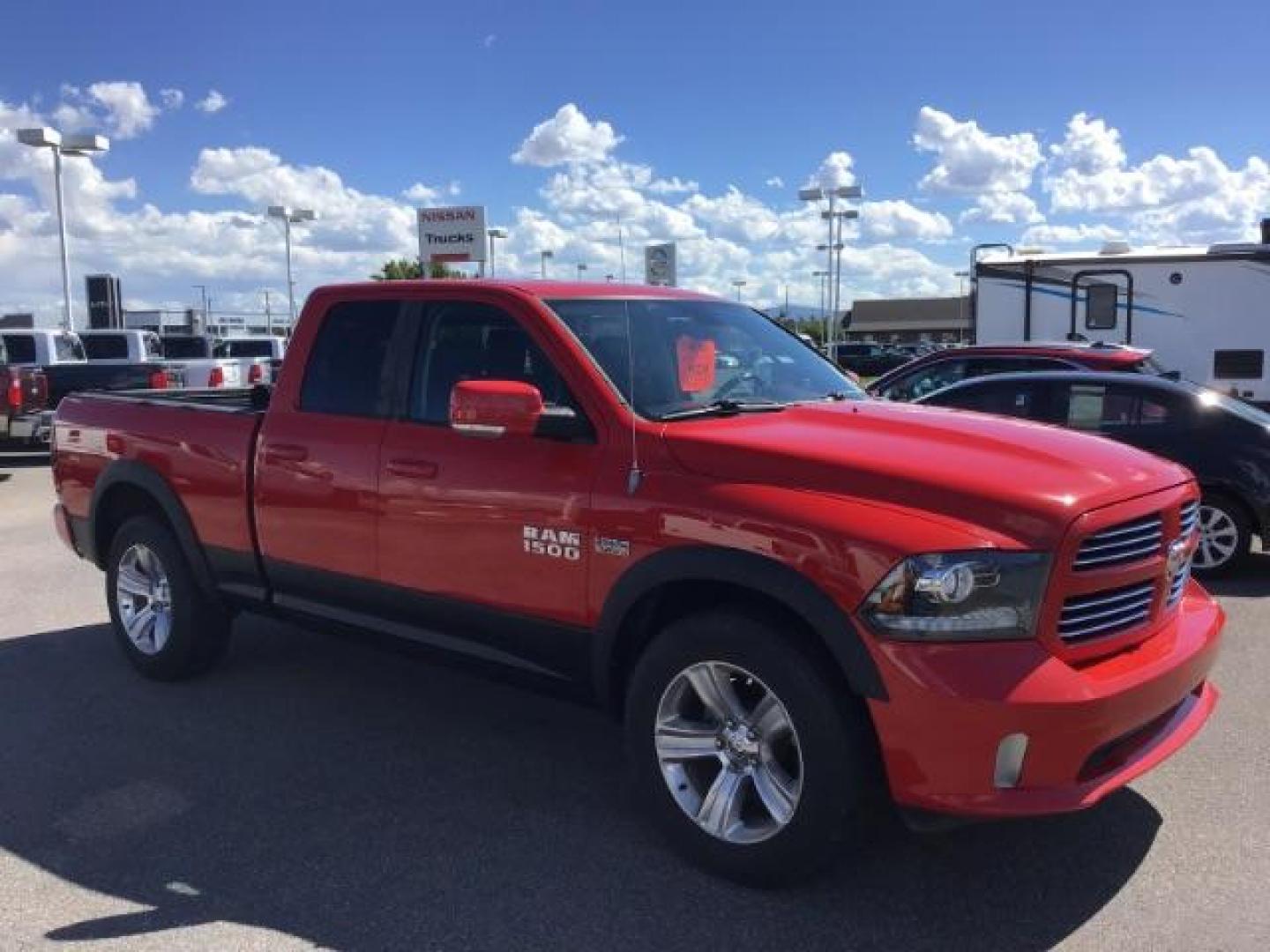 2013 Flame Red /Black Cloth Interior RAM 1500 Sport Quad Cab 4WD (1C6RR7HT4DS) with an 5.7L V8 OHV 16V engine, 6-Speed Automatic transmission, located at 1235 N Woodruff Ave., Idaho Falls, 83401, (208) 523-1053, 43.507172, -112.000488 - Leather, sport package, 4X4, Bluetooth, Alpine Sound System, heated and cooled seats, heated steering wheel, tow package, 6.6' bed, Tonneau cover. At Timberline Auto it is always easy to find a great deal on your next vehicle! Our experienced sales staff can help find the right vehicle that will fi - Photo#6