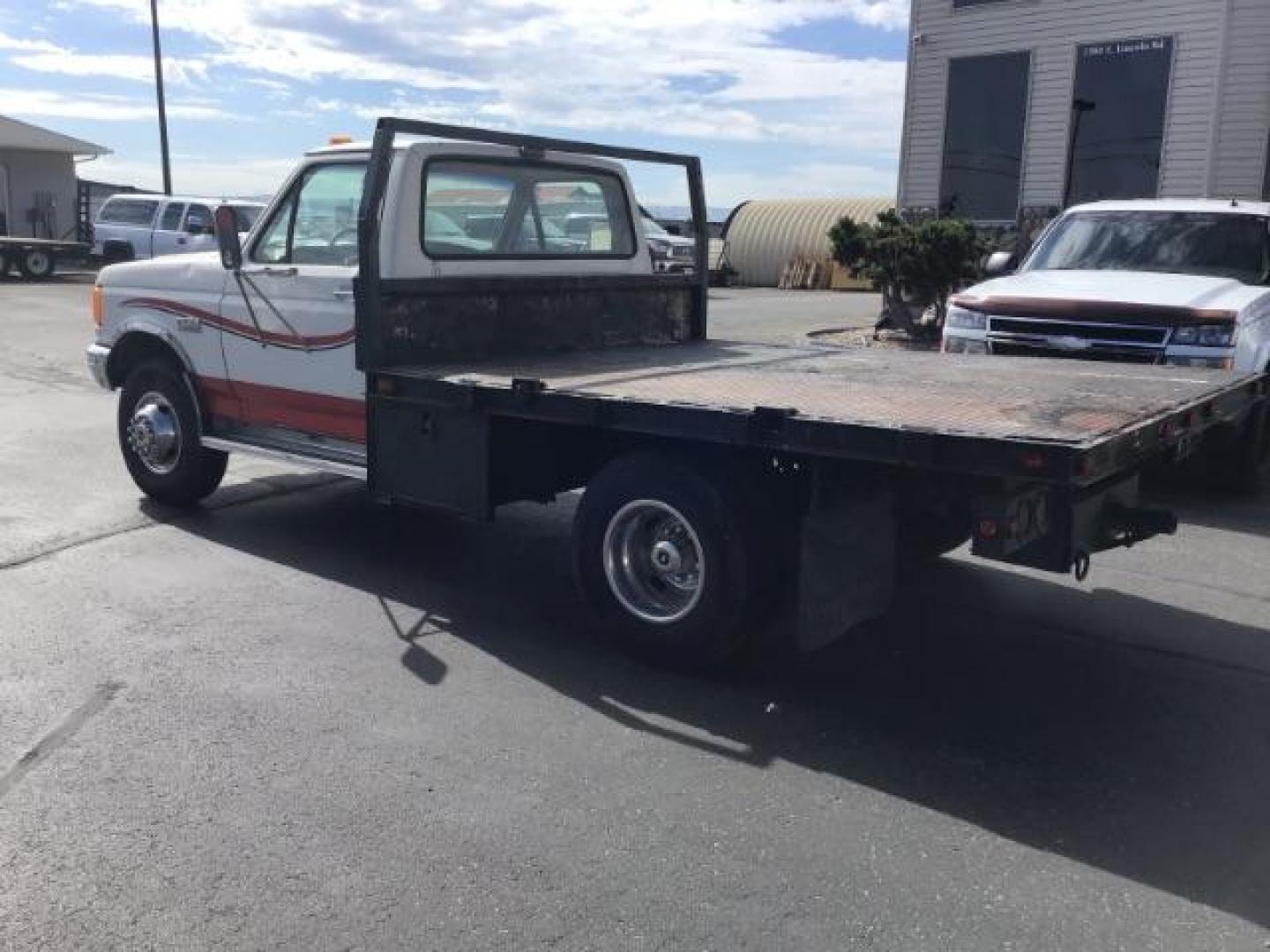 1989 Ford F-450 SD Chassis Cab 2WD (2FDLF47G6KC) with an 7.5L V8 engine, located at 1235 N Woodruff Ave., Idaho Falls, 83401, (208) 523-1053, 43.507172, -112.000488 - This 1989 Ford F450, has a 8 foot flat bed and a 5 speed manual transmission. At Timberline Auto it is always easy to find a great deal on your next vehicle! Our experienced sales staff can help find the right vehicle will fit your needs. Our knowledgeable finance department has options for almost a - Photo#2