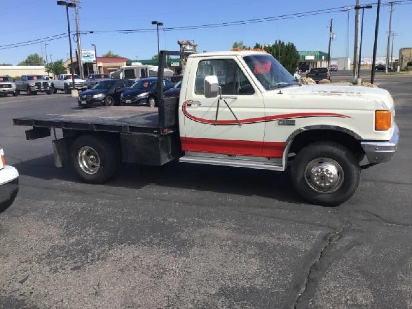 1989 Ford F-450 SD Chassis Cab 2WD (2FDLF47G6KC) with an 7.5L V8 engine, located at 1235 N Woodruff Ave., Idaho Falls, 83401, (208) 523-1053, 43.507172, -112.000488 - This 1989 Ford F450, has a 8 foot flat bed and a 5 speed manual transmission. At Timberline Auto it is always easy to find a great deal on your next vehicle! Our experienced sales staff can help find the right vehicle will fit your needs. Our knowledgeable finance department has options for almost a - Photo#4