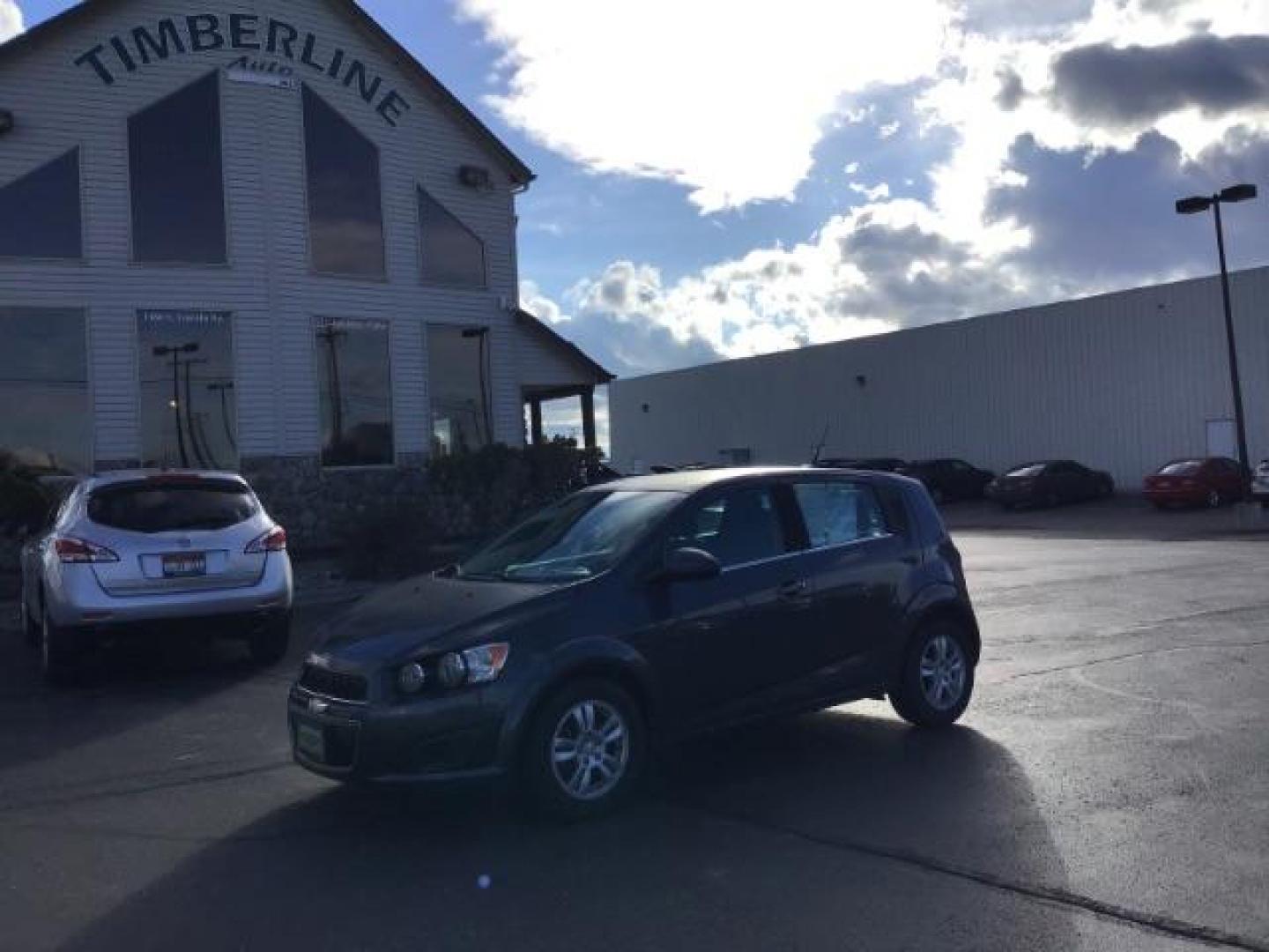 2013 Black Granite Metallic Chevrolet Sonic LT Auto 5-Door (1G1JC6SG7D4) with an 1.8L L4 DOHC 24V engine, 6-Speed Automatic transmission, located at 1235 N Woodruff Ave., Idaho Falls, 83401, (208) 523-1053, 43.507172, -112.000488 - This 2013 Chevrolet Sonic, has the 4 cylinder motor. It has 95,000 miles. It comes with Steering wheel audio controls, cruise control, bluetooth audio, and CD player. At Timberline Auto it is always easy to find a great deal on your next vehicle! Our experienced sales staff can help find the right v - Photo#0