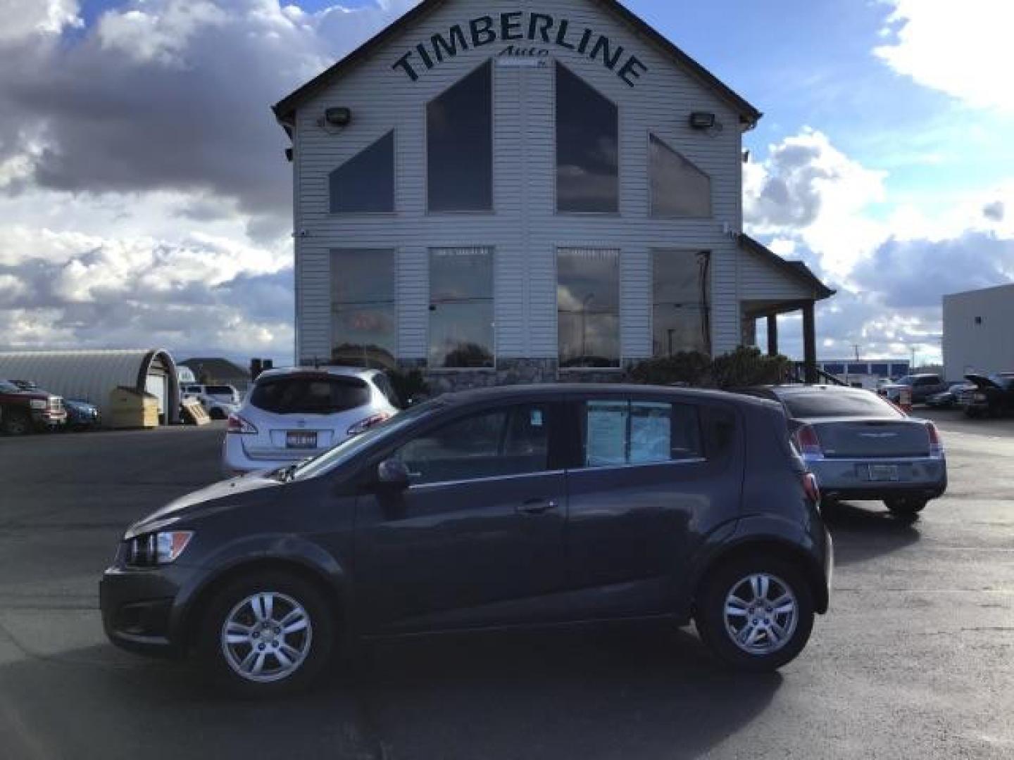 2013 Black Granite Metallic Chevrolet Sonic LT Auto 5-Door (1G1JC6SG7D4) with an 1.8L L4 DOHC 24V engine, 6-Speed Automatic transmission, located at 1235 N Woodruff Ave., Idaho Falls, 83401, (208) 523-1053, 43.507172, -112.000488 - This 2013 Chevrolet Sonic, has the 4 cylinder motor. It has 95,000 miles. It comes with Steering wheel audio controls, cruise control, bluetooth audio, and CD player. At Timberline Auto it is always easy to find a great deal on your next vehicle! Our experienced sales staff can help find the right v - Photo#1