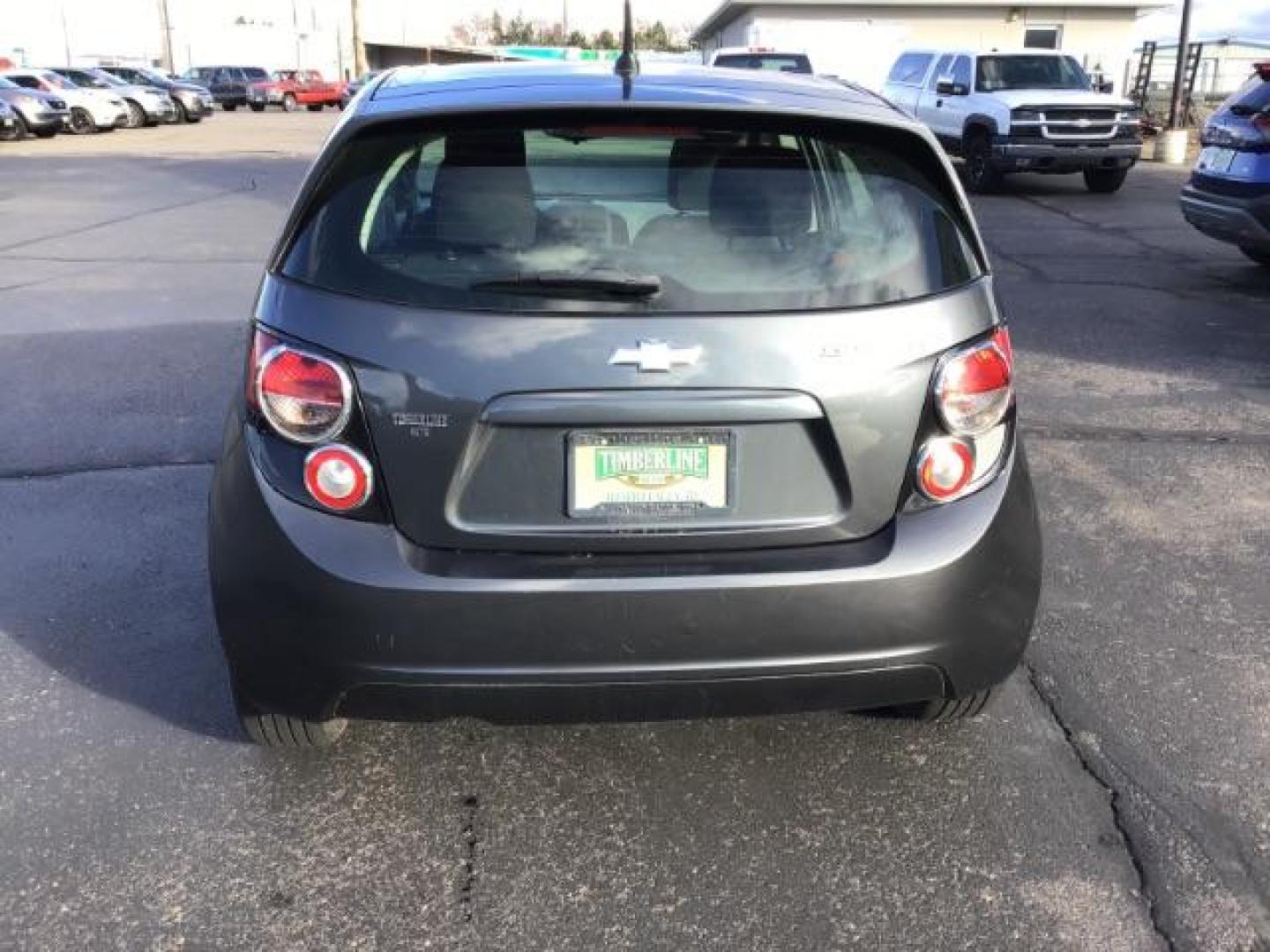 2013 Black Granite Metallic Chevrolet Sonic LT Auto 5-Door (1G1JC6SG7D4) with an 1.8L L4 DOHC 24V engine, 6-Speed Automatic transmission, located at 1235 N Woodruff Ave., Idaho Falls, 83401, (208) 523-1053, 43.507172, -112.000488 - This 2013 Chevrolet Sonic, has the 4 cylinder motor. It has 95,000 miles. It comes with Steering wheel audio controls, cruise control, bluetooth audio, and CD player. At Timberline Auto it is always easy to find a great deal on your next vehicle! Our experienced sales staff can help find the right v - Photo#3