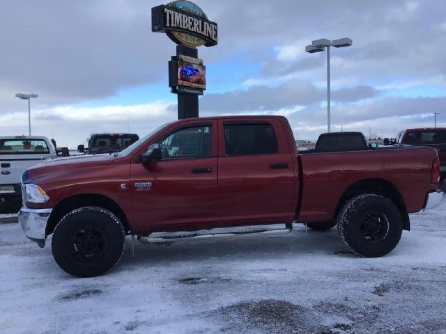 2012 Deep Cherry Red Crystal Pearl /Dark Slate/Medium Graystone Cloth Interior RAM 2500 ST Crew Cab SWB 4WD (3C6UD5CL6CG) with an 6.7L L6 OHV 24V TURBO DIESEL engine, 6-Speed Automatic transmission, located at 1235 N Woodruff Ave., Idaho Falls, 83401, (208) 523-1053, 43.507172, -112.000488 - This 2012 Ram 2500 ST 4x4, has the 6.7L Diesel motor. It has 175,000 miles. Comes with Cloth interior, AM/FM stereo, bluetooth audio, and power windows. At Timberline Auto it is always easy to find a great deal on your next vehicle! Our experienced sales staff can help find the right vehicle that wi - Photo#1