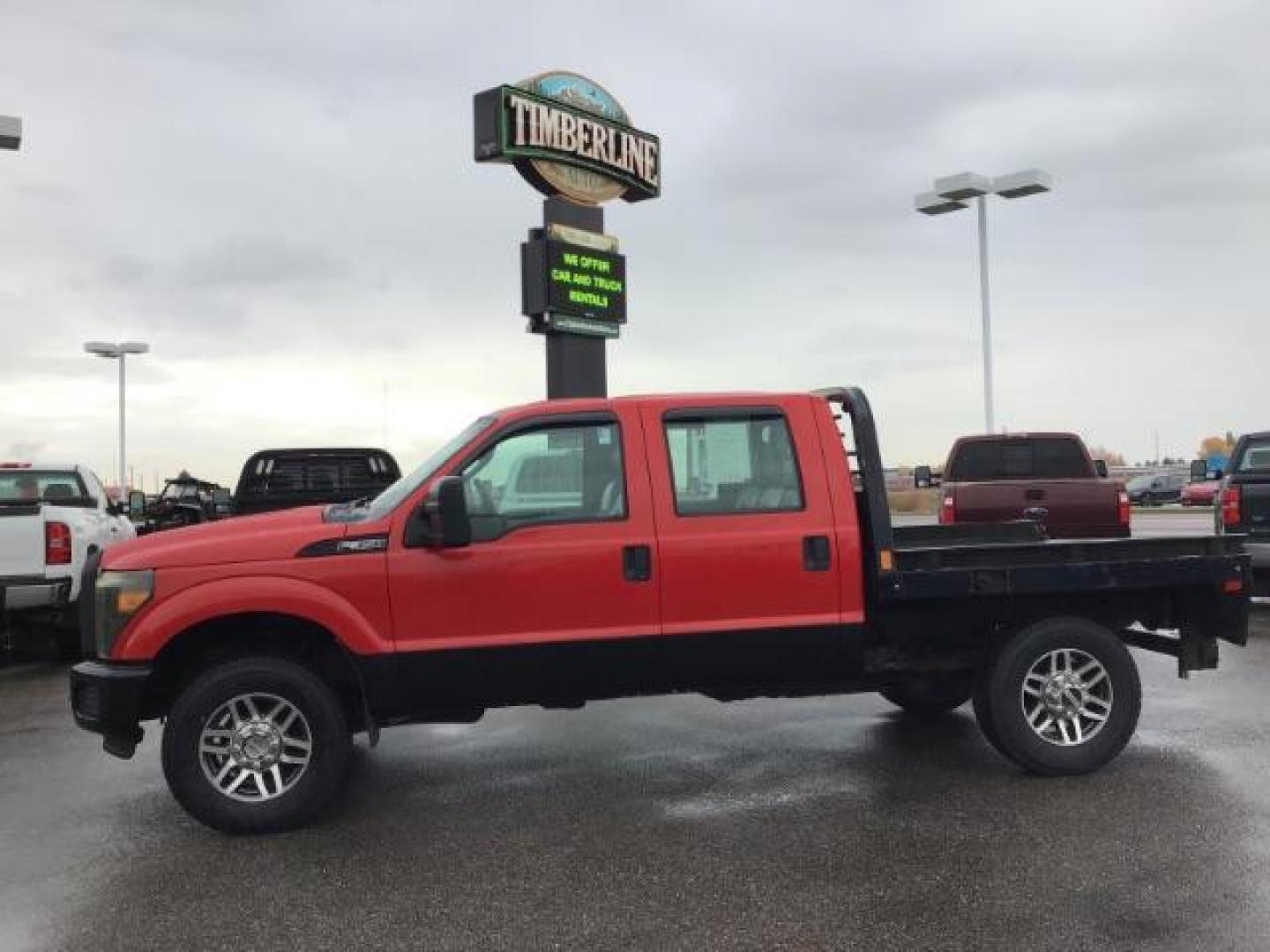 2013 Vermillion Red /Steel Vinyl Interior Ford F-350 SD XL Crew Cab 4WD (1FT8W3B60DE) with an 6.2L V8 OHV 16V engine, 6-Speed Automatic transmission, located at 1235 N Woodruff Ave., Idaho Falls, 83401, (208) 523-1053, 43.507172, -112.000488 - This 2013 Ford F350 XL. Has the 6.2L V8 motor. It only has 99,446 miles. It has the Flat bed, and plenty of room to haul people around. At Timberline Auto it is always easy to find a great deal on your next vehicle! Our experienced sales staff can help find the right vehicle that will fit your needs - Photo#1