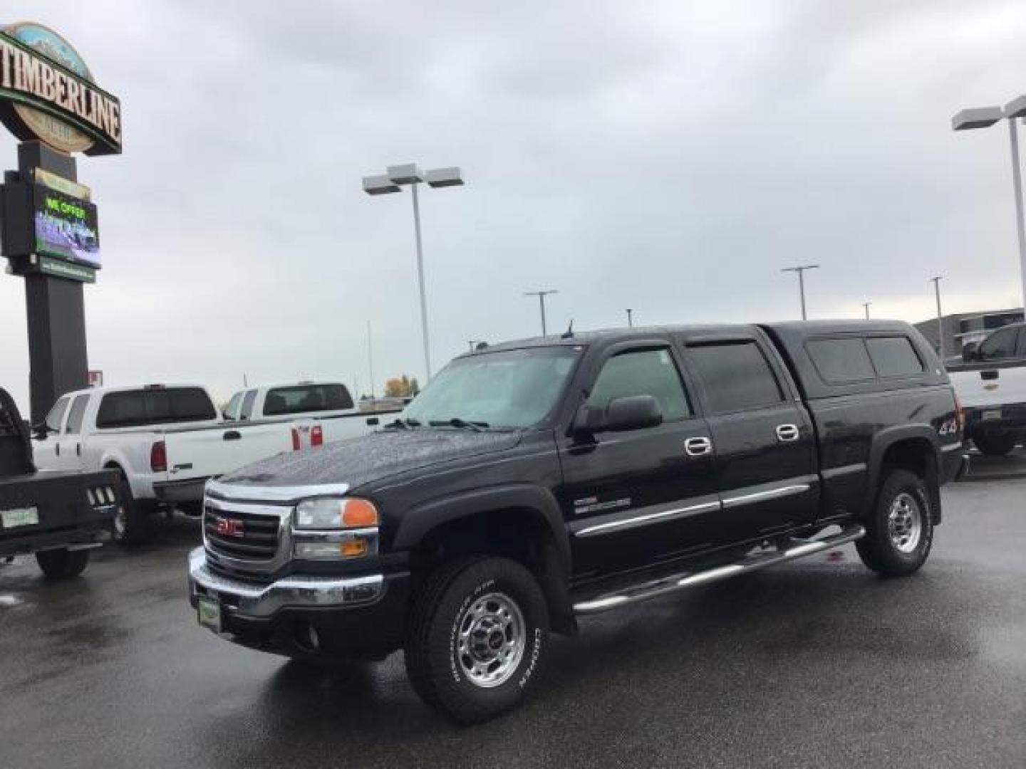 2005 Onyx Black GMC Sierra 2500HD SLT Crew Cab Short Bed 4WD (1GTHK23275F) with an 6.6L V8 OHV 32V TURBO DIESEL engine, 5-Speed Automatic transmission, located at 1235 N Woodruff Ave., Idaho Falls, 83401, (208) 523-1053, 43.507172, -112.000488 - This 2005 GMC 2500 SLT, has the 6.6L Diesel motor. It only has 117,477 miles. I has leather interior, heated seats, and Bose stereo system. At Timberline Auto it is always easy to find a great deal on your next vehicle! Our experienced sales staff can help find the right vehicle that will fit your n - Photo#0