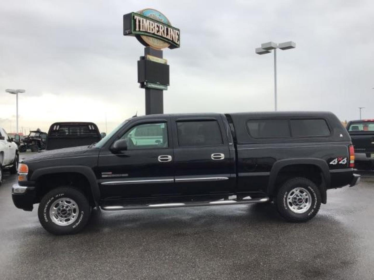 2005 Onyx Black GMC Sierra 2500HD SLT Crew Cab Short Bed 4WD (1GTHK23275F) with an 6.6L V8 OHV 32V TURBO DIESEL engine, 5-Speed Automatic transmission, located at 1235 N Woodruff Ave., Idaho Falls, 83401, (208) 523-1053, 43.507172, -112.000488 - This 2005 GMC 2500 SLT, has the 6.6L Diesel motor. It only has 117,477 miles. I has leather interior, heated seats, and Bose stereo system. At Timberline Auto it is always easy to find a great deal on your next vehicle! Our experienced sales staff can help find the right vehicle that will fit your n - Photo#1