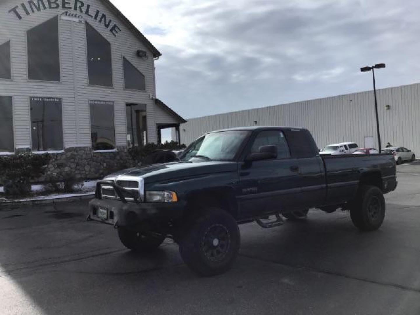 1998 GREEN /Mist Gray Cloth Dodge Ram 2500 Quad Cab 6.5-ft. Bed 4WD (1B7KF2360WJ) with an 5.9L L6 OHV 24V TURBO DIESEL engine, 5-Speed Manual transmission, located at 1235 N Woodruff Ave., Idaho Falls, 83401, (208) 523-1053, 43.507172, -112.000488 - At Timberline Auto it is always easy to find a great deal on your next vehicle! Our experienced sales staff can help find the right vehicle will fit your needs. Our knowledgeable finance department has options for almost any credit score. We offer many warranty contract options to protect you new pr - Photo#0