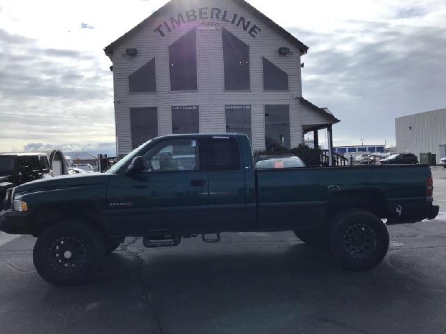 1998 GREEN /Mist Gray Cloth Dodge Ram 2500 Quad Cab 6.5-ft. Bed 4WD (1B7KF2360WJ) with an 5.9L L6 OHV 24V TURBO DIESEL engine, 5-Speed Manual transmission, located at 1235 N Woodruff Ave., Idaho Falls, 83401, (208) 523-1053, 43.507172, -112.000488 - At Timberline Auto it is always easy to find a great deal on your next vehicle! Our experienced sales staff can help find the right vehicle will fit your needs. Our knowledgeable finance department has options for almost any credit score. We offer many warranty contract options to protect you new pr - Photo#1