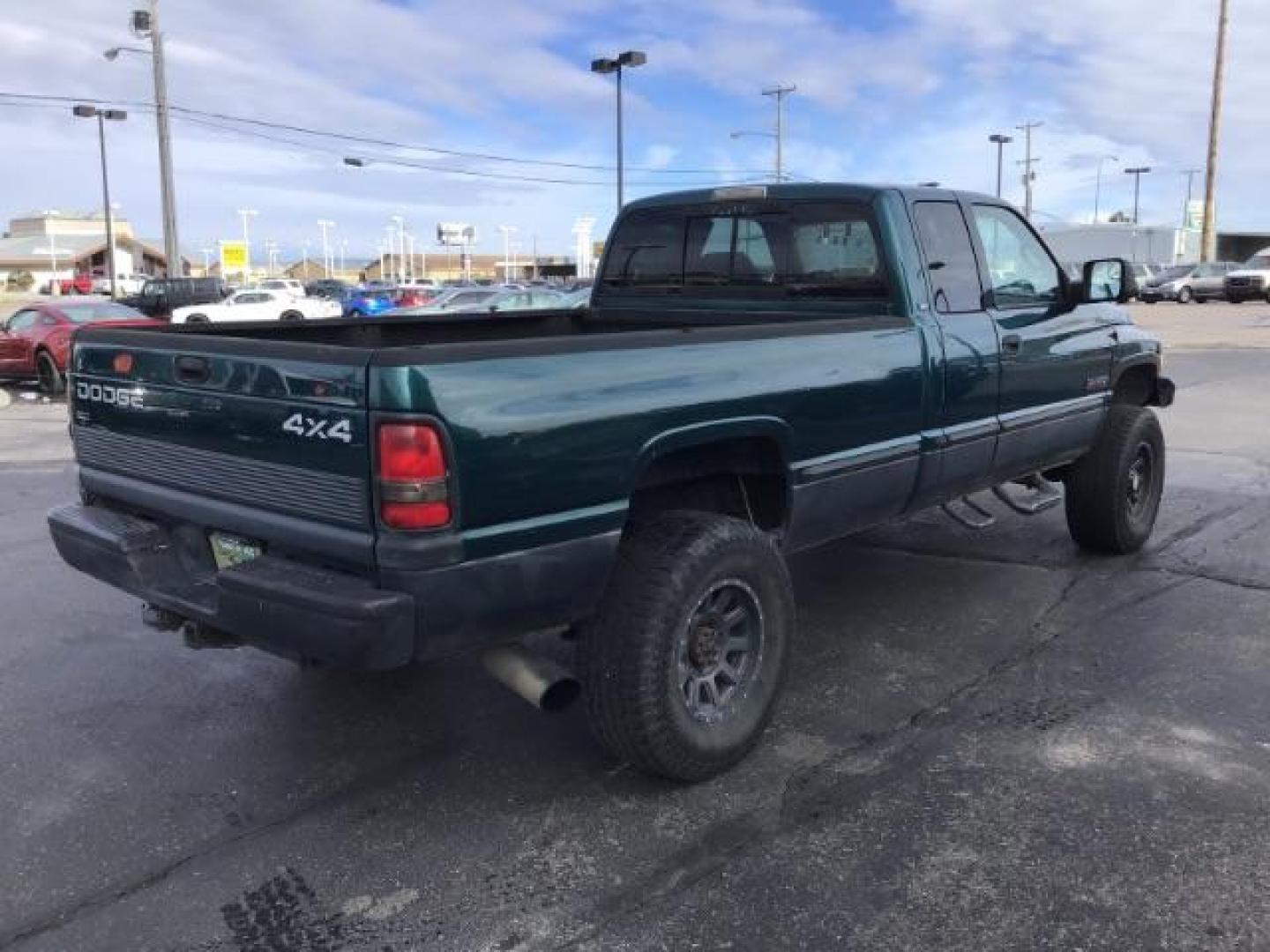 1998 GREEN /Mist Gray Cloth Dodge Ram 2500 Quad Cab 6.5-ft. Bed 4WD (1B7KF2360WJ) with an 5.9L L6 OHV 24V TURBO DIESEL engine, 5-Speed Manual transmission, located at 1235 N Woodruff Ave., Idaho Falls, 83401, (208) 523-1053, 43.507172, -112.000488 - At Timberline Auto it is always easy to find a great deal on your next vehicle! Our experienced sales staff can help find the right vehicle will fit your needs. Our knowledgeable finance department has options for almost any credit score. We offer many warranty contract options to protect you new pr - Photo#4