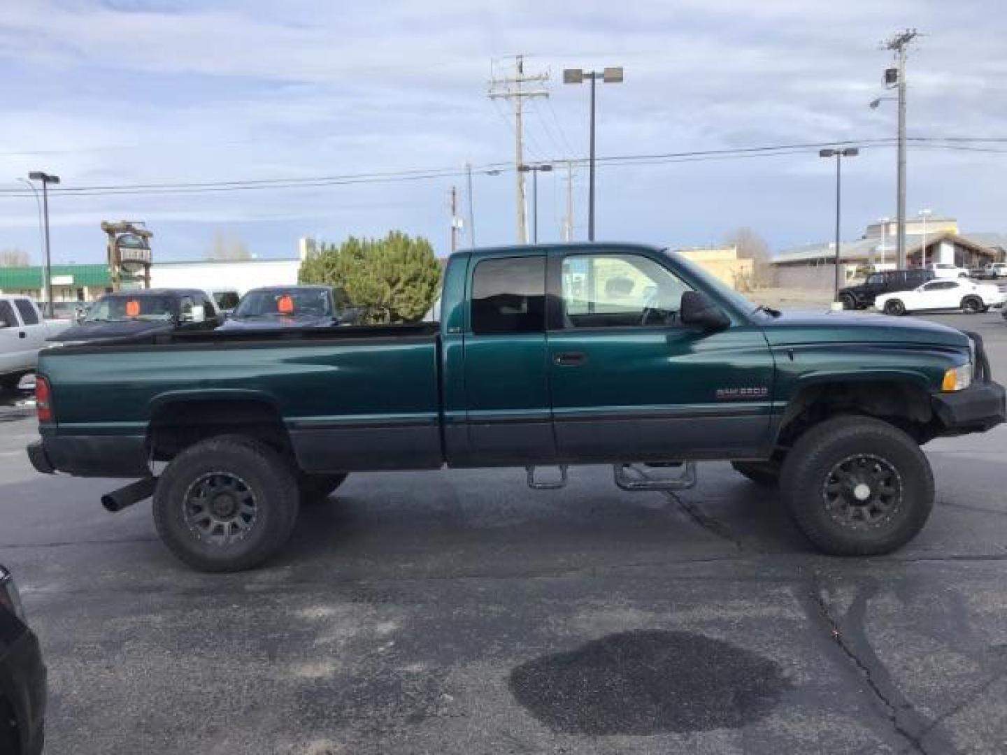 1998 GREEN /Mist Gray Cloth Dodge Ram 2500 Quad Cab 6.5-ft. Bed 4WD (1B7KF2360WJ) with an 5.9L L6 OHV 24V TURBO DIESEL engine, 5-Speed Manual transmission, located at 1235 N Woodruff Ave., Idaho Falls, 83401, (208) 523-1053, 43.507172, -112.000488 - At Timberline Auto it is always easy to find a great deal on your next vehicle! Our experienced sales staff can help find the right vehicle will fit your needs. Our knowledgeable finance department has options for almost any credit score. We offer many warranty contract options to protect you new pr - Photo#5