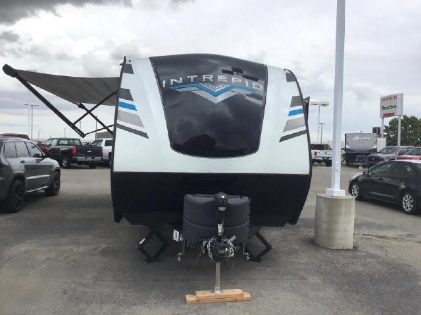 2021 WHITE Riverside RV INTREPID RB200 (59CCC2920ML) , located at 1235 N Woodruff Ave., Idaho Falls, 83401, (208) 523-1053, 43.507172, -112.000488 - 4 leveling jacks, stabilizer with heavy duty adjustable drop hitch, outdoor speakers and lights, power awning and slides, 500# rear cargo rack, new tires, campground cable tv hookup, multiple USB charging ports, easy access fire extinguisher, dual recliners with cup holders, Inno flame fireplace, ga - Photo#0