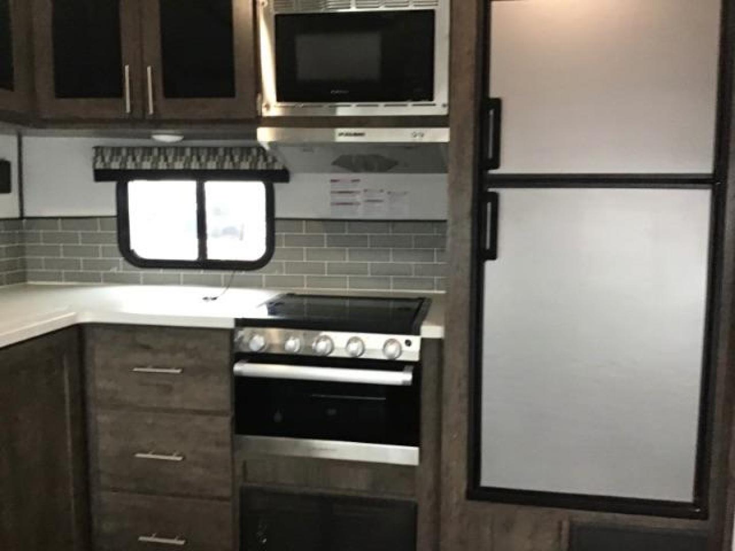 2021 WHITE Riverside RV INTREPID RB200 (59CCC2920ML) , located at 1235 N Woodruff Ave., Idaho Falls, 83401, (208) 523-1053, 43.507172, -112.000488 - 4 leveling jacks, stabilizer with heavy duty adjustable drop hitch, outdoor speakers and lights, power awning and slides, 500# rear cargo rack, new tires, campground cable tv hookup, multiple USB charging ports, easy access fire extinguisher, dual recliners with cup holders, Inno flame fireplace, ga - Photo#11