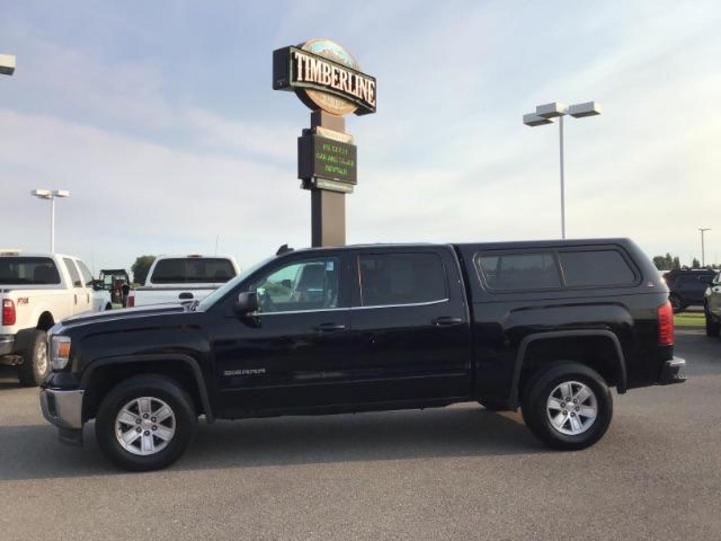 2015 Onyx Black /Jet Black, cloth GMC Sierra 1500 SLE Crew Cab Short Box 2WD (3GTP1UEC2FG) with an 5.3L V8 OHV 16V engine, 6-Speed Automatic transmission, located at 1235 N Woodruff Ave., Idaho Falls, 83401, (208) 523-1053, 43.507172, -112.000488 - This 2015 GMC 1500 SLT, has the 5.3L motor. It has a spray in bedliner, AM/FM CD, keyless remote, Alloy wheels. Interior and exterior and in very good condition At Timberline Auto it is always easy to find a great deal on your next vehicle! Our experienced sales staff can help find the right vehicle - Photo#1