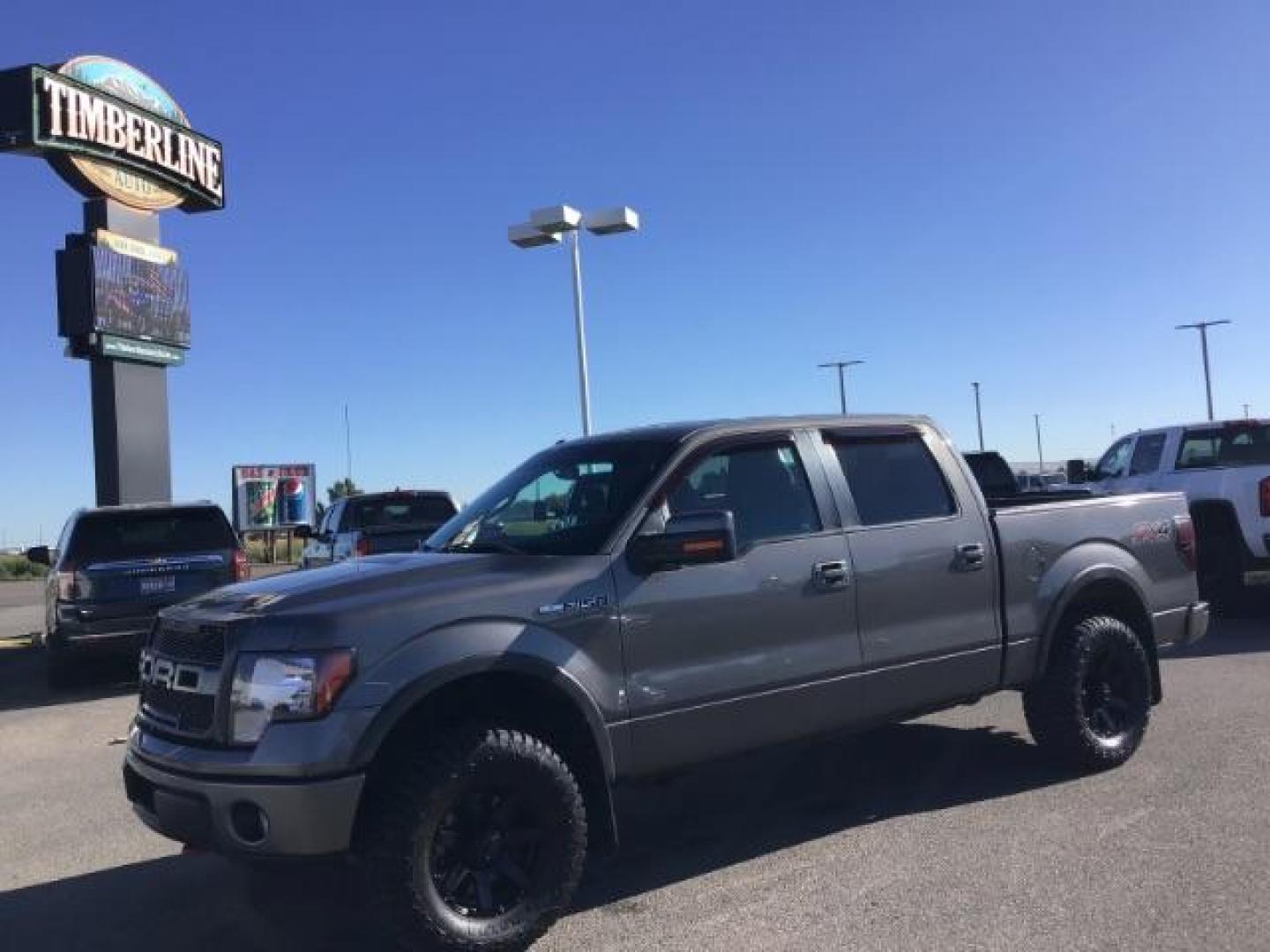 2013 GRAY /CLOTH Ford F-150 FX4 SuperCrew 5.5-ft. Bed 4WD (1FTFW1EF5DK) with an 5.0L V8 engine, 6-Speed Automatic transmission, located at 1235 N Woodruff Ave., Idaho Falls, 83401, (208) 523-1053, 43.507172, -112.000488 - This 2013 Ford F150 FX4, only has 87,414 miles. Comes with after market wheel, after market grill, red interior accents, steering wheel audio controls. It has a leveling kit. At Timberline Auto it is always easy to find a great deal on your next vehicle! Our experienced sales staff can help find the - Photo#0