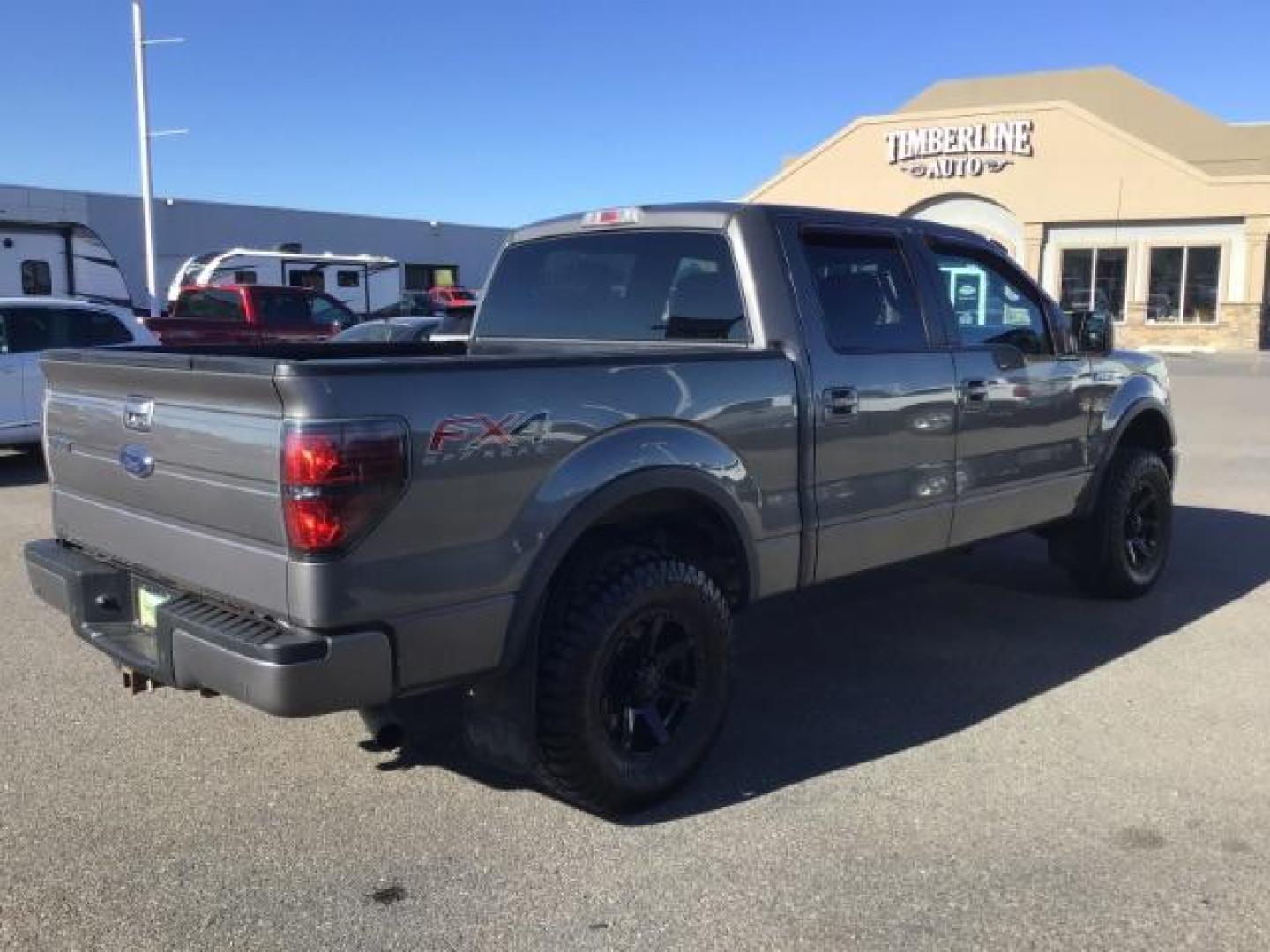 2013 GRAY /CLOTH Ford F-150 FX4 SuperCrew 5.5-ft. Bed 4WD (1FTFW1EF5DK) with an 5.0L V8 engine, 6-Speed Automatic transmission, located at 1235 N Woodruff Ave., Idaho Falls, 83401, (208) 523-1053, 43.507172, -112.000488 - This 2013 Ford F150 FX4, only has 87,414 miles. Comes with after market wheel, after market grill, red interior accents, steering wheel audio controls. It has a leveling kit. At Timberline Auto it is always easy to find a great deal on your next vehicle! Our experienced sales staff can help find the - Photo#4