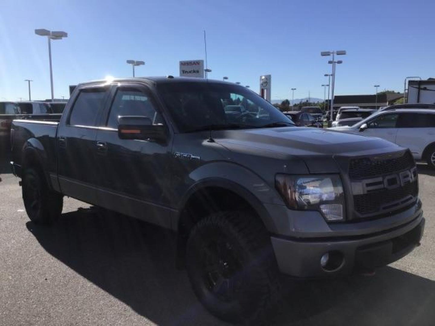 2013 GRAY /CLOTH Ford F-150 FX4 SuperCrew 5.5-ft. Bed 4WD (1FTFW1EF5DK) with an 5.0L V8 engine, 6-Speed Automatic transmission, located at 1235 N Woodruff Ave., Idaho Falls, 83401, (208) 523-1053, 43.507172, -112.000488 - This 2013 Ford F150 FX4, only has 87,414 miles. Comes with after market wheel, after market grill, red interior accents, steering wheel audio controls. It has a leveling kit. At Timberline Auto it is always easy to find a great deal on your next vehicle! Our experienced sales staff can help find the - Photo#6