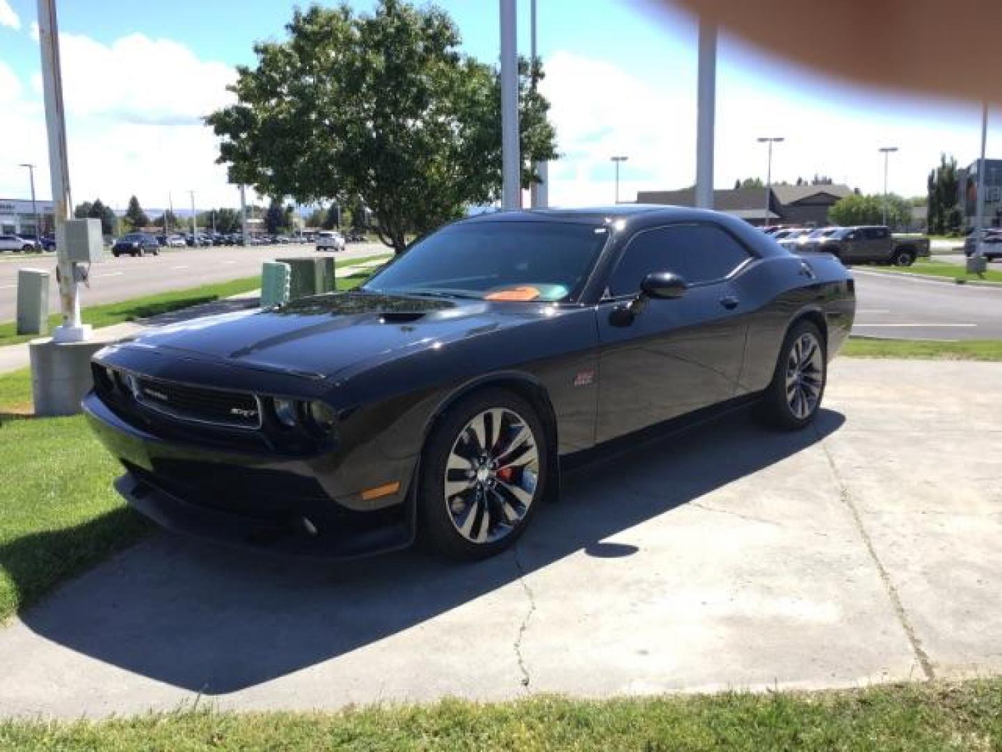 2014 Black Clearcoat /Radar Red/Dk Slate Gray Dodge Challenger SRT8 (2C3CDYCJ5EH) with an 6.4L V8 OHV 16V engine, 5-Speed Automatic transmission, located at 1235 N Woodruff Ave., Idaho Falls, 83401, (208) 523-1053, 43.507172, -112.000488 - SRT8, 392 Hemi, leather, automatic transmission,, heated seats, sunroof, multiple charge and USB ports, navigation, heated steering wheel, park assist, very low miles. At Timberline Auto it is always easy to find a great deal on your next vehicle! Our experienced sales staff can help find the right - Photo#0