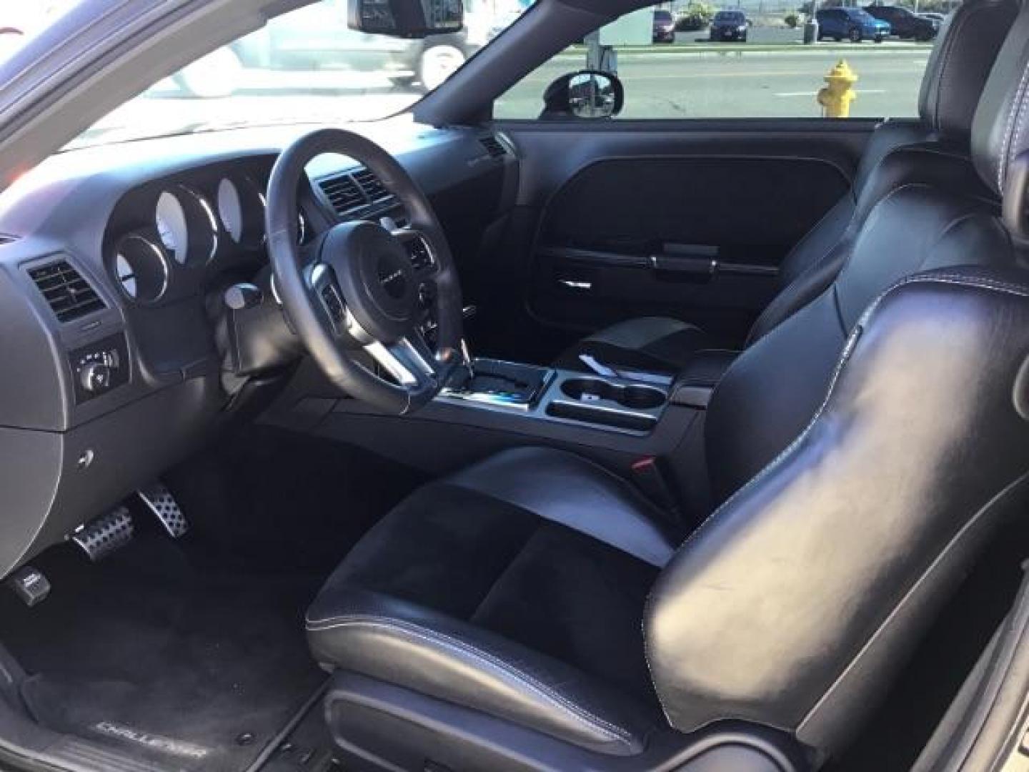 2014 Black Clearcoat /Radar Red/Dk Slate Gray Dodge Challenger SRT8 (2C3CDYCJ5EH) with an 6.4L V8 OHV 16V engine, 5-Speed Automatic transmission, located at 1235 N Woodruff Ave., Idaho Falls, 83401, (208) 523-1053, 43.507172, -112.000488 - SRT8, 392 Hemi, leather, automatic transmission,, heated seats, sunroof, multiple charge and USB ports, navigation, heated steering wheel, park assist, very low miles. At Timberline Auto it is always easy to find a great deal on your next vehicle! Our experienced sales staff can help find the right - Photo#12