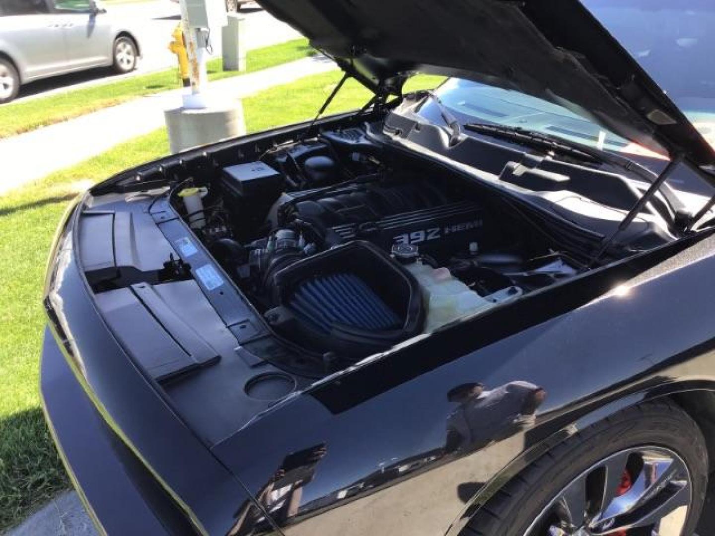 2014 Black Clearcoat /Radar Red/Dk Slate Gray Dodge Challenger SRT8 (2C3CDYCJ5EH) with an 6.4L V8 OHV 16V engine, 5-Speed Automatic transmission, located at 1235 N Woodruff Ave., Idaho Falls, 83401, (208) 523-1053, 43.507172, -112.000488 - SRT8, 392 Hemi, leather, automatic transmission,, heated seats, sunroof, multiple charge and USB ports, navigation, heated steering wheel, park assist, very low miles. At Timberline Auto it is always easy to find a great deal on your next vehicle! Our experienced sales staff can help find the right - Photo#15