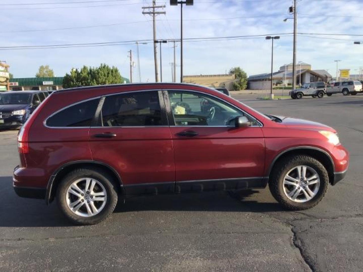 2011 Tango Red Pearl /Black Cloth Interior Honda CR-V EX 2WD 5-Speed AT (JHLRE3H59BC) with an 2.4L L4 DOHC 16V engine, 5-Speed Automatic transmission, located at 1235 N Woodruff Ave., Idaho Falls, 83401, (208) 523-1053, 43.507172, -112.000488 - At Timberline Auto it is always easy to find a great deal on your next vehicle! Our experienced sales staff can help find the right vehicle will fit your needs. Our knowledgeable finance department has options for almost any credit score. We offer many warranty contract options to protect you new pr - Photo#5