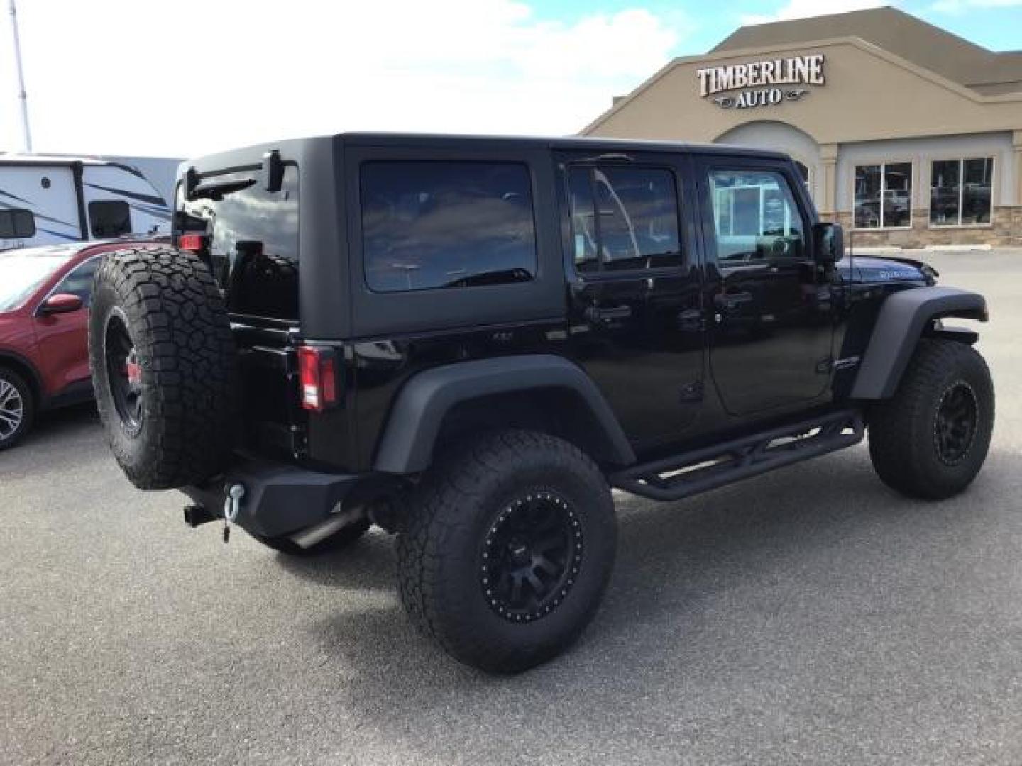 2018 Black Clear Coat /Black, leather Jeep Wrangler JK Unlimited Rubicon 4WD (1C4BJWFG1JL) with an 3.6L V6 DOHC 24V FFV engine, 6-Speed Automatic transmission, located at 1235 N Woodruff Ave., Idaho Falls, 83401, (208) 523-1053, 43.507172, -112.000488 - This 2018 Jeep Wrangler Unlimited Rubicon, has the 3.6L V6 motor. It only has 40,552 miles. It comes with Keyless remote, Heated Seats, power windows, back up camera, and bluetooth capabilities. At Timberline Auto it is always easy to find a great deal on your next vehicle! Our experienced sales st - Photo#4