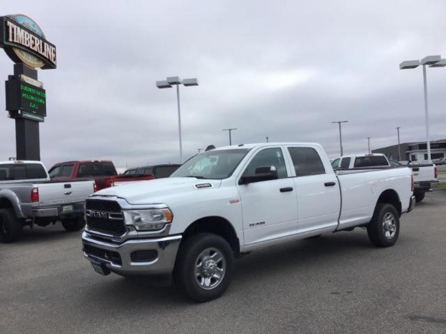 2021 Bright White Clear Coat /Black/Diesel Gray RAM 2500 Tradesman Crew Cab LWB 4WD (3C6UR5HJ9MG) with an 6.4L V8 engine, 6-Speed Automatic transmission, located at 1235 N Woodruff Ave., Idaho Falls, 83401, (208) 523-1053, 43.507172, -112.000488 - This 2021 Ram 2500 Tradesmen, has the 6.4L V8 motor. It has 52,634 miles. Comes with cloth interior, back up camera, keyless remote, and bluetooth. At Timberline Auto it is always easy to find a great deal on your next vehicle! Our experienced sales staff can help find the right vehicle that will fi - Photo#0