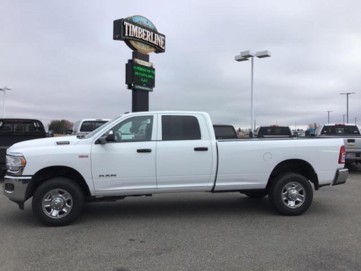 2021 Bright White Clear Coat /Black/Diesel Gray RAM 2500 Tradesman Crew Cab LWB 4WD (3C6UR5HJ9MG) with an 6.4L V8 engine, 6-Speed Automatic transmission, located at 1235 N Woodruff Ave., Idaho Falls, 83401, (208) 523-1053, 43.507172, -112.000488 - This 2021 Ram 2500 Tradesmen, has the 6.4L V8 motor. It has 52,634 miles. Comes with cloth interior, back up camera, keyless remote, and bluetooth. At Timberline Auto it is always easy to find a great deal on your next vehicle! Our experienced sales staff can help find the right vehicle that will fi - Photo#1