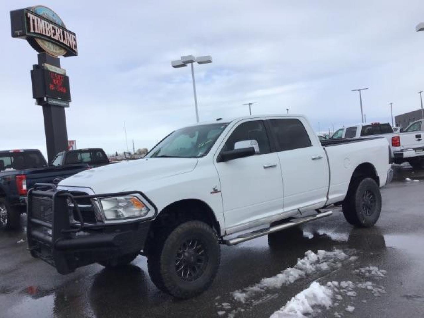 2013 Bright White Clearcoat /Diesel Gray/Black RAM 2500 SLT Crew Cab SWB 4WD (3C6UR5DL9DG) with an 6.7L L6 OHV 24V TURBO DIESEL engine, 6-Speed Automatic transmission, located at 1235 N Woodruff Ave., Idaho Falls, 83401, (208) 523-1053, 43.507172, -112.000488 - This 2013 Ram 2500 SLT 4x4, has the 6.7l diesel motor. It has 196,000 miles. It comes with cloth interior, back up camera, blue tooth audio, spray in bed liner, power mirrors, and power windows. At Timberline Auto it is always easy to find a great deal on your next vehicle! Our experienced sales sta - Photo#0