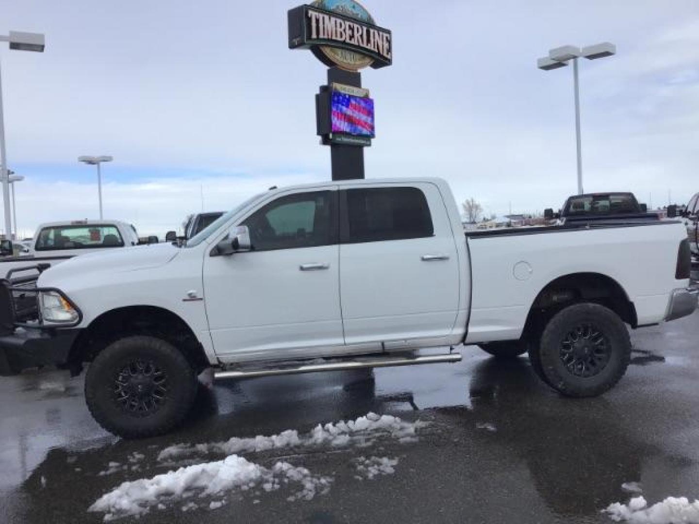 2013 Bright White Clearcoat /Diesel Gray/Black RAM 2500 SLT Crew Cab SWB 4WD (3C6UR5DL9DG) with an 6.7L L6 OHV 24V TURBO DIESEL engine, 6-Speed Automatic transmission, located at 1235 N Woodruff Ave., Idaho Falls, 83401, (208) 523-1053, 43.507172, -112.000488 - This 2013 Ram 2500 SLT 4x4, has the 6.7l diesel motor. It has 196,000 miles. It comes with cloth interior, back up camera, blue tooth audio, spray in bed liner, power mirrors, and power windows. At Timberline Auto it is always easy to find a great deal on your next vehicle! Our experienced sales sta - Photo#1