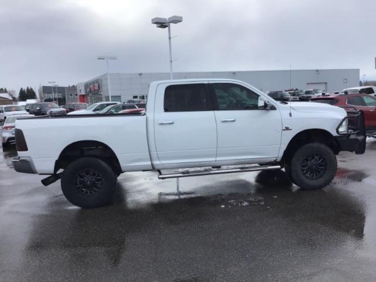 2013 Bright White Clearcoat /Diesel Gray/Black RAM 2500 SLT Crew Cab SWB 4WD (3C6UR5DL9DG) with an 6.7L L6 OHV 24V TURBO DIESEL engine, 6-Speed Automatic transmission, located at 1235 N Woodruff Ave., Idaho Falls, 83401, (208) 523-1053, 43.507172, -112.000488 - This 2013 Ram 2500 SLT 4x4, has the 6.7l diesel motor. It has 196,000 miles. It comes with cloth interior, back up camera, blue tooth audio, spray in bed liner, power mirrors, and power windows. At Timberline Auto it is always easy to find a great deal on your next vehicle! Our experienced sales sta - Photo#5