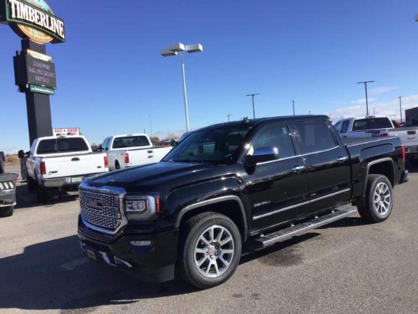 2018 Onyx Black /Cocoa/Dark Sand, leather GMC Sierra 1500 Denali Crew Cab Short Box 4WD (3GTU2PEJ0JG) with an 6.2L V8 OHV 16V engine, 6-Speed Automatic transmission, located at 1235 N Woodruff Ave., Idaho Falls, 83401, (208) 523-1053, 43.507172, -112.000488 - This 2018 GMC 1500 Denali has the 6.2L motor. It has 84,620. This is a really nice truck, that is loaded up with options. At Timberline Auto it is always easy to find a great deal on your next vehicle! Our experienced sales staff can help find the right vehicle that will fit your needs. Our knowledg - Photo#0