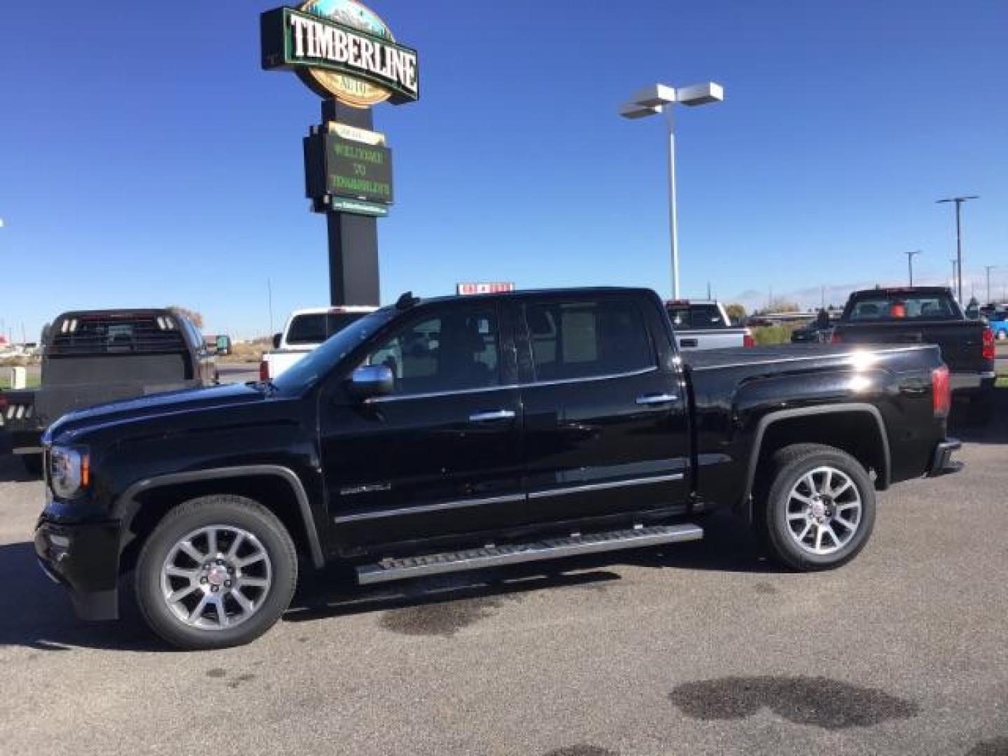 2018 Onyx Black /Cocoa/Dark Sand, leather GMC Sierra 1500 Denali Crew Cab Short Box 4WD (3GTU2PEJ0JG) with an 6.2L V8 OHV 16V engine, 6-Speed Automatic transmission, located at 1235 N Woodruff Ave., Idaho Falls, 83401, (208) 523-1053, 43.507172, -112.000488 - This 2018 GMC 1500 Denali has the 6.2L motor. It has 84,620. This is a really nice truck, that is loaded up with options. At Timberline Auto it is always easy to find a great deal on your next vehicle! Our experienced sales staff can help find the right vehicle that will fit your needs. Our knowledg - Photo#1